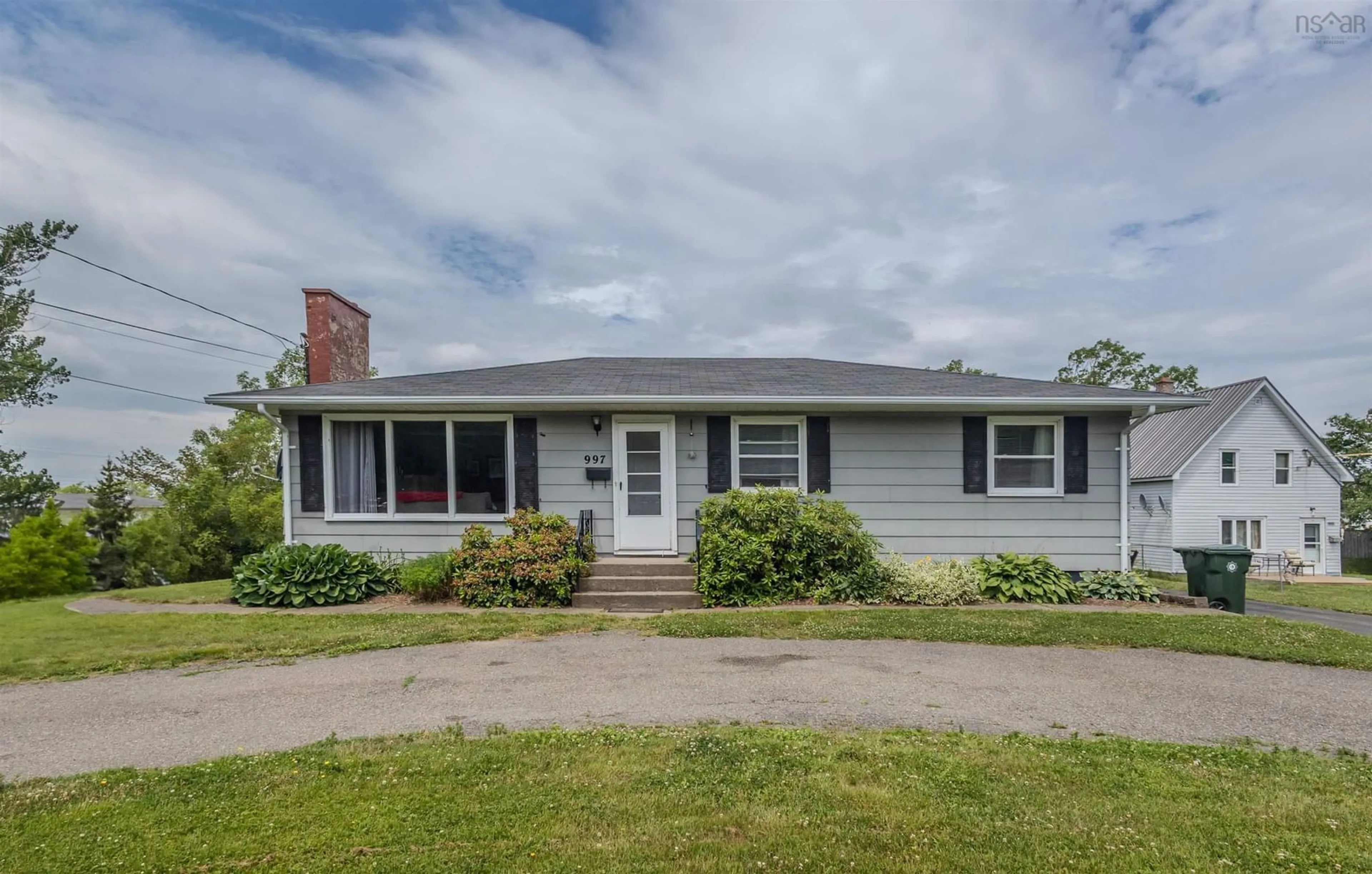 Home with vinyl exterior material, street for 997 Upper Prince St, Sydney Nova Scotia B1P 5P3