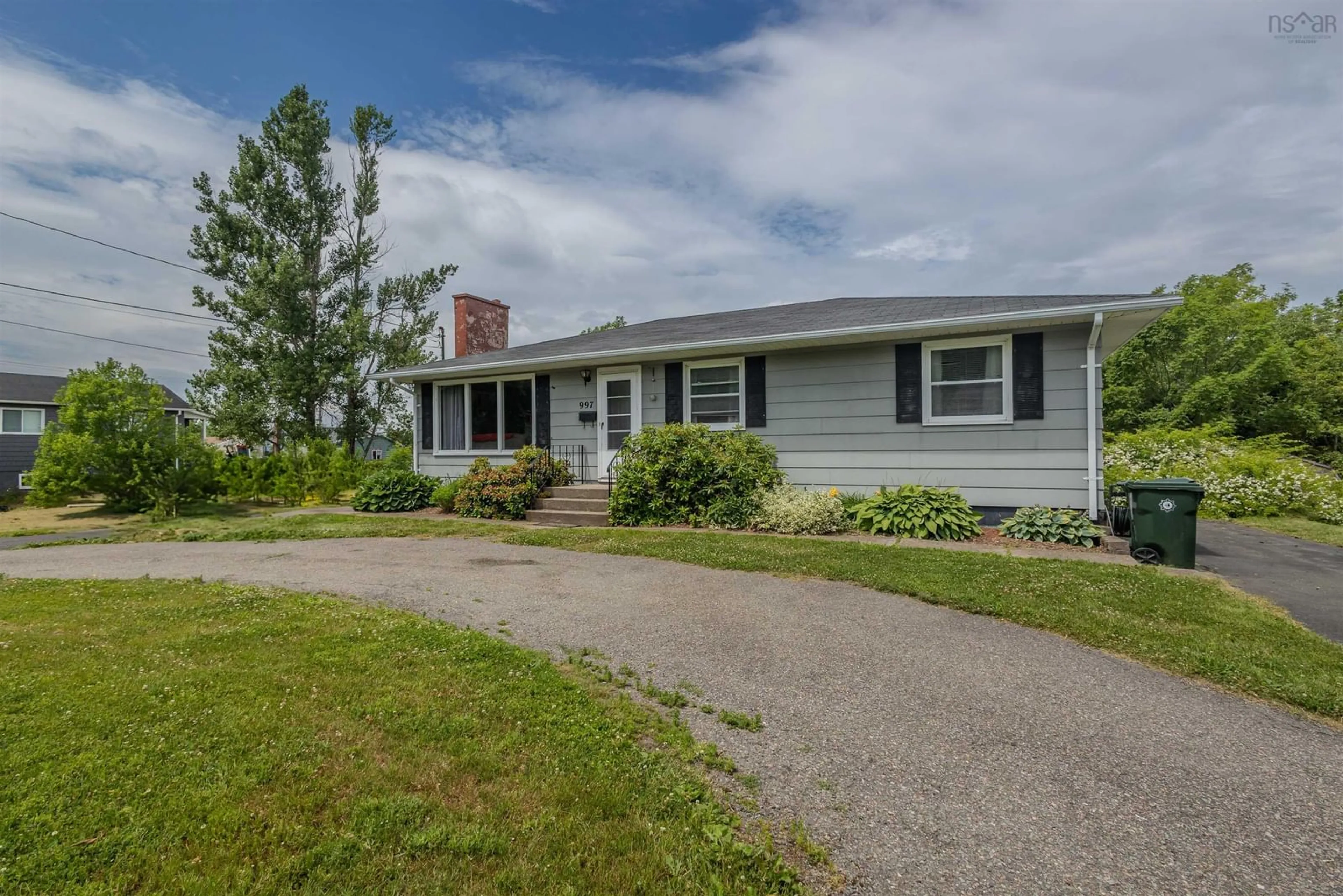 Home with vinyl exterior material, street for 997 Upper Prince St, Sydney Nova Scotia B1P 5P3