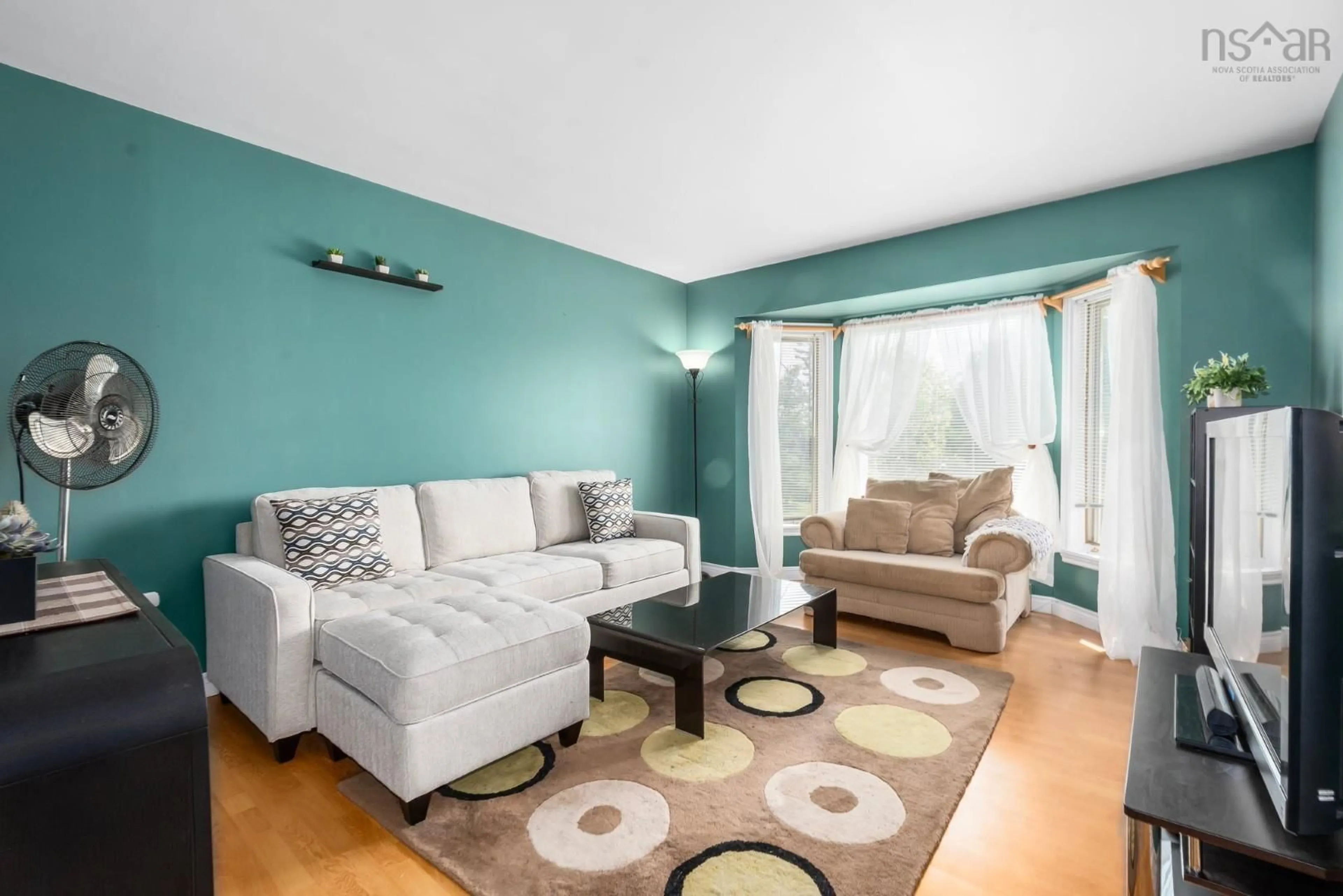 Living room with furniture, wood/laminate floor for 10 Laurelcrest Dr, Eastern Passage Nova Scotia E3G 1N3