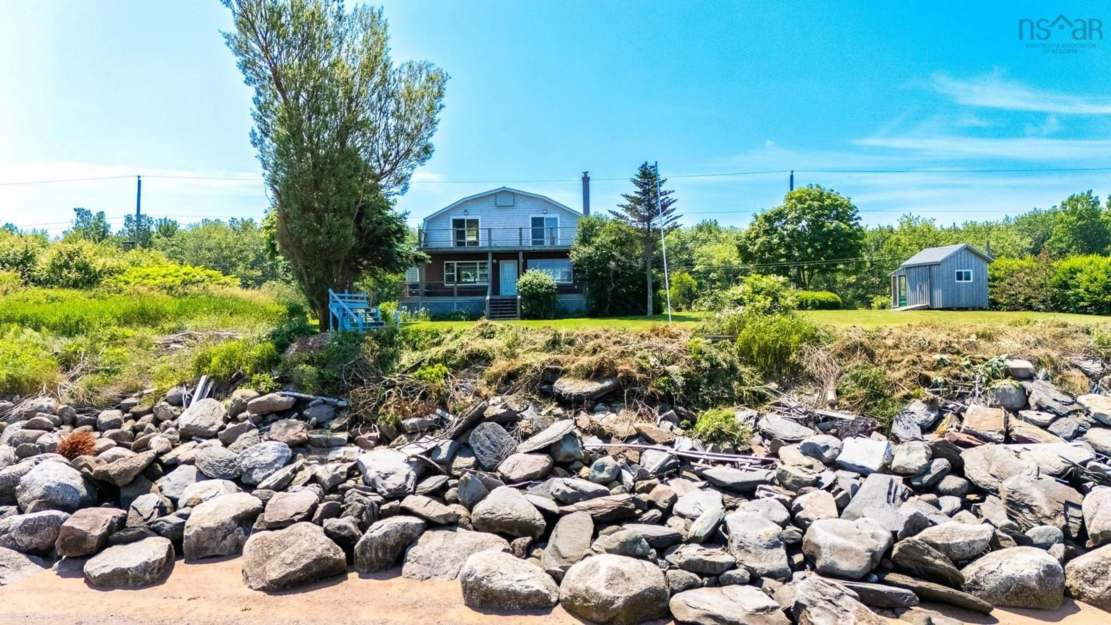 A pic from outside/outdoor area/front of a property/back of a property/a pic from drone, water/lake/river/ocean view for 102 Pheasant Rd, North Grand Pre Nova Scotia B0P 1M0