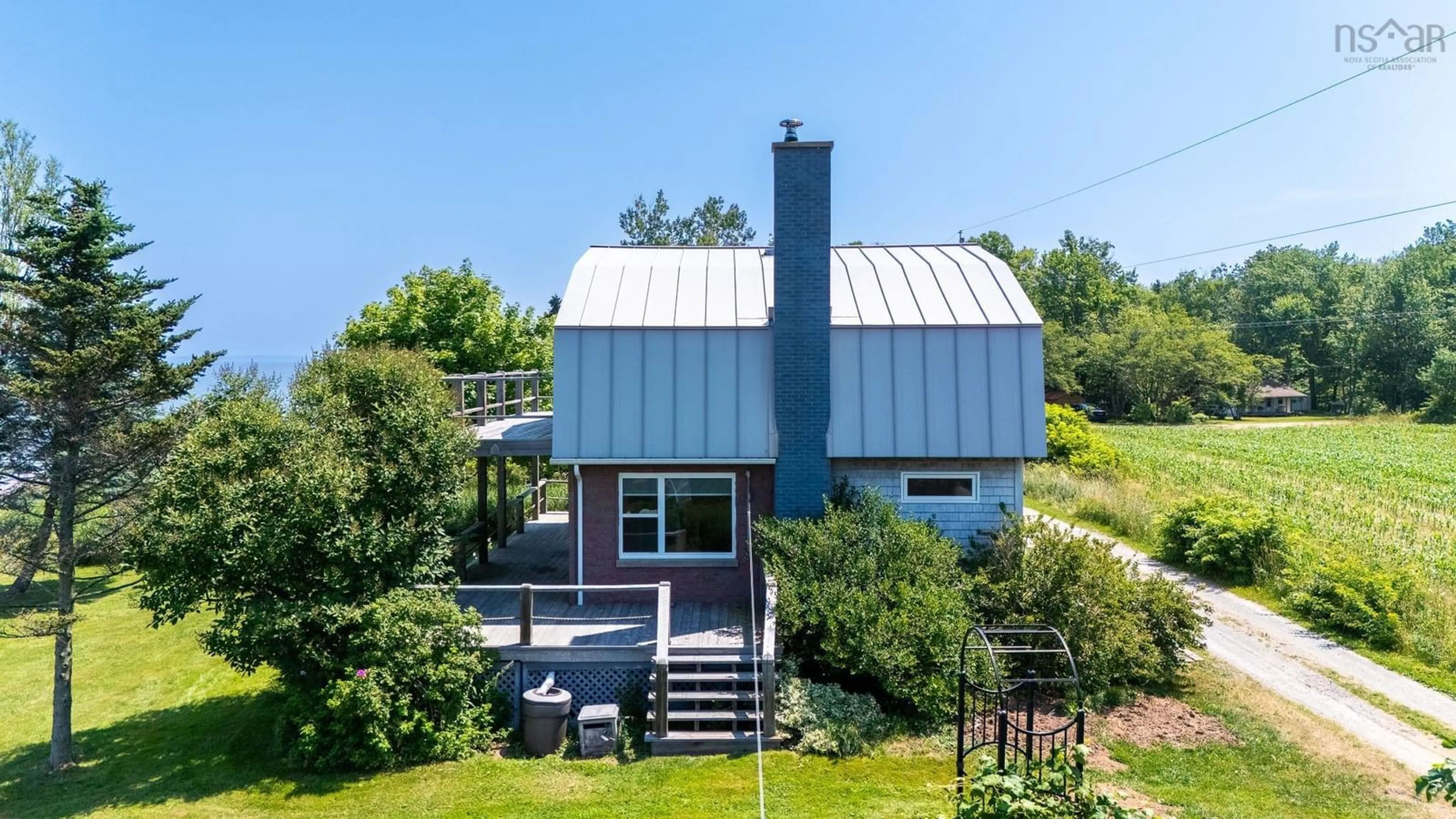 A pic from outside/outdoor area/front of a property/back of a property/a pic from drone, water/lake/river/ocean view for 102 Pheasant Rd, North Grand Pre Nova Scotia B0P 1M0