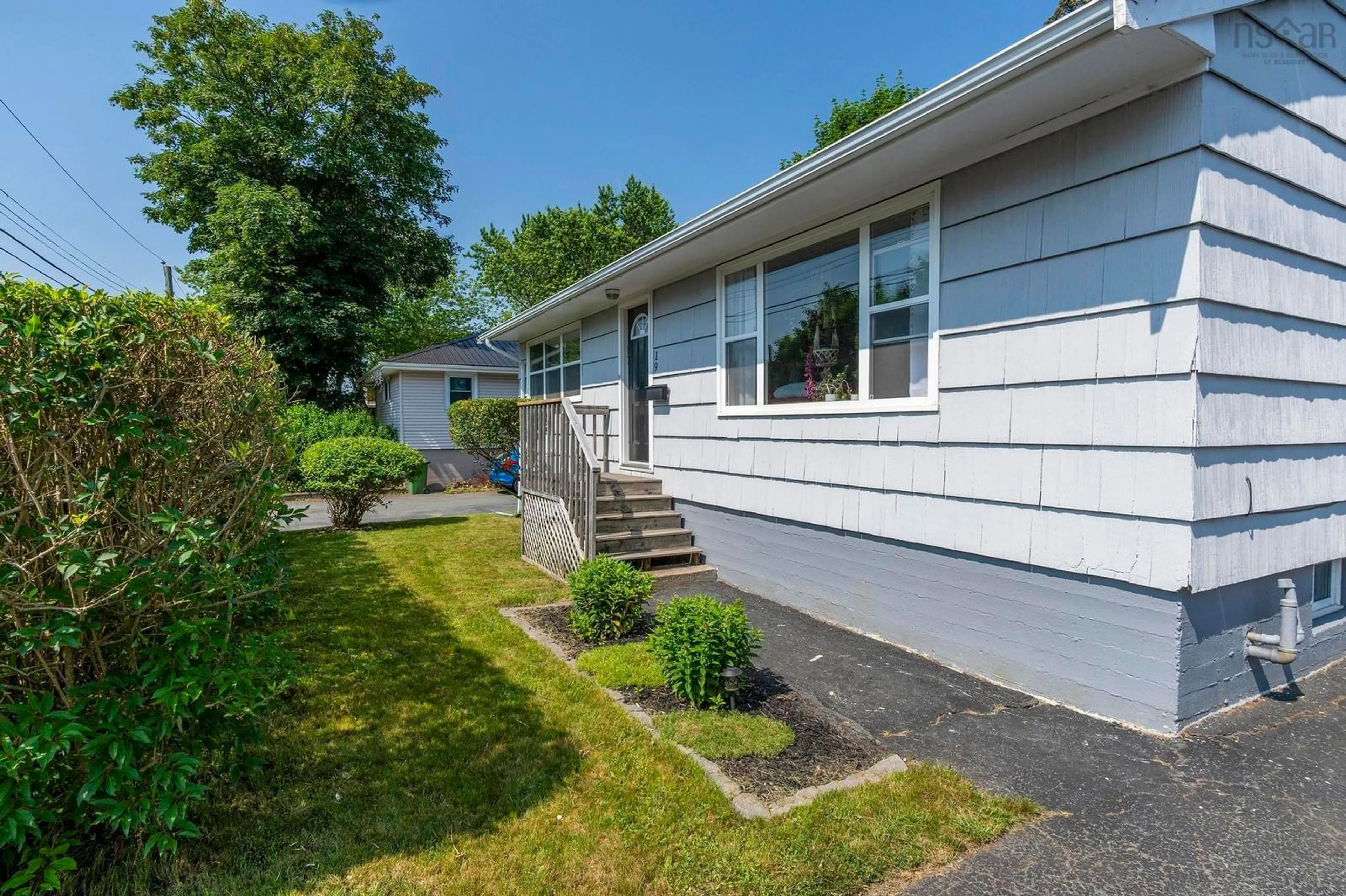 Home with vinyl exterior material, street for 19 Woodland Ave, Dartmouth Nova Scotia B3A 3J6