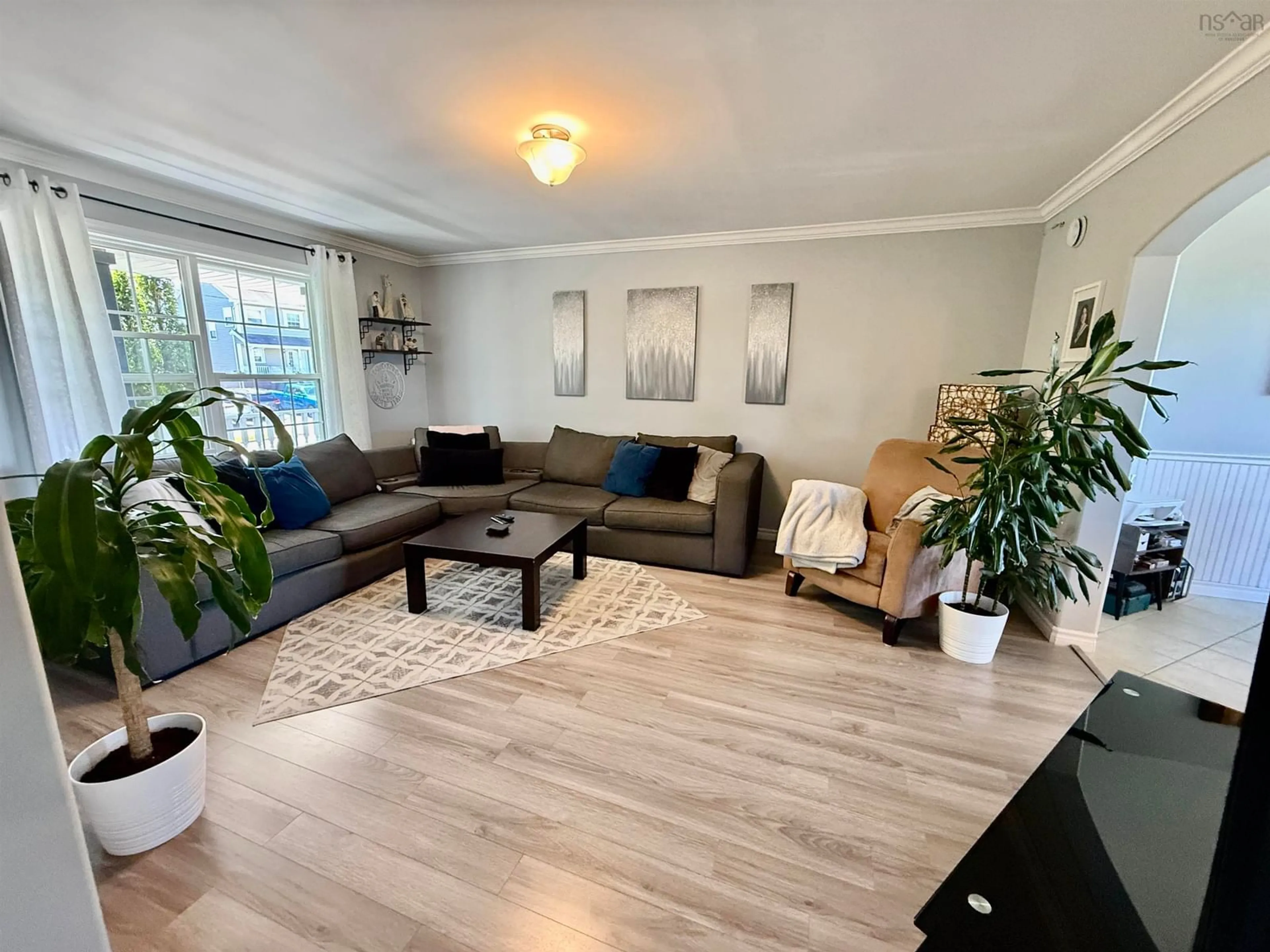 Living room with furniture, wood/laminate floor for 153 Beech Tree Run, Beechville Nova Scotia B3T 2G1