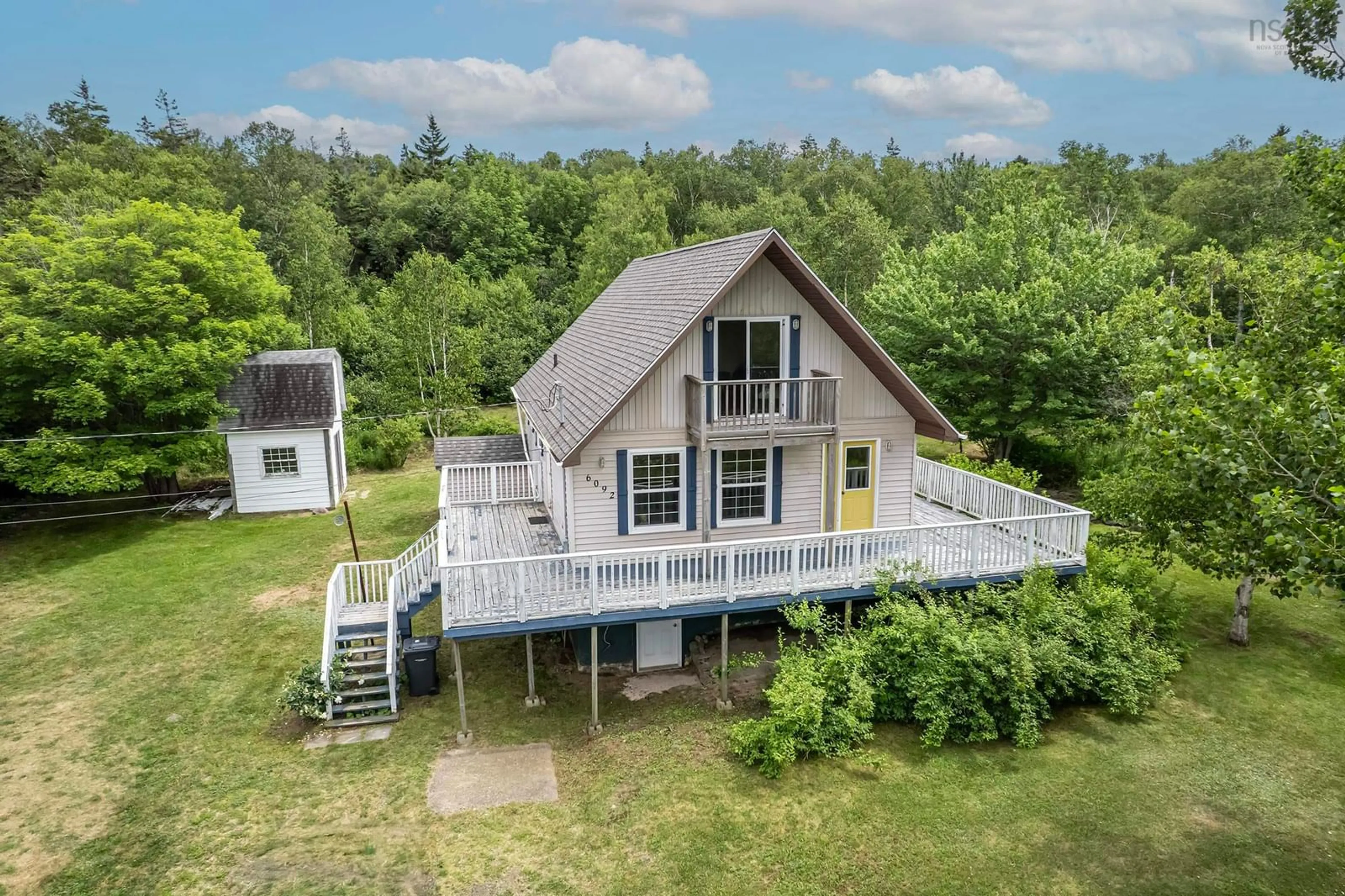 A pic from outside/outdoor area/front of a property/back of a property/a pic from drone, water/lake/river/ocean view for 6092 Shore Rd, Youngs Cove Nova Scotia B0S 1L0