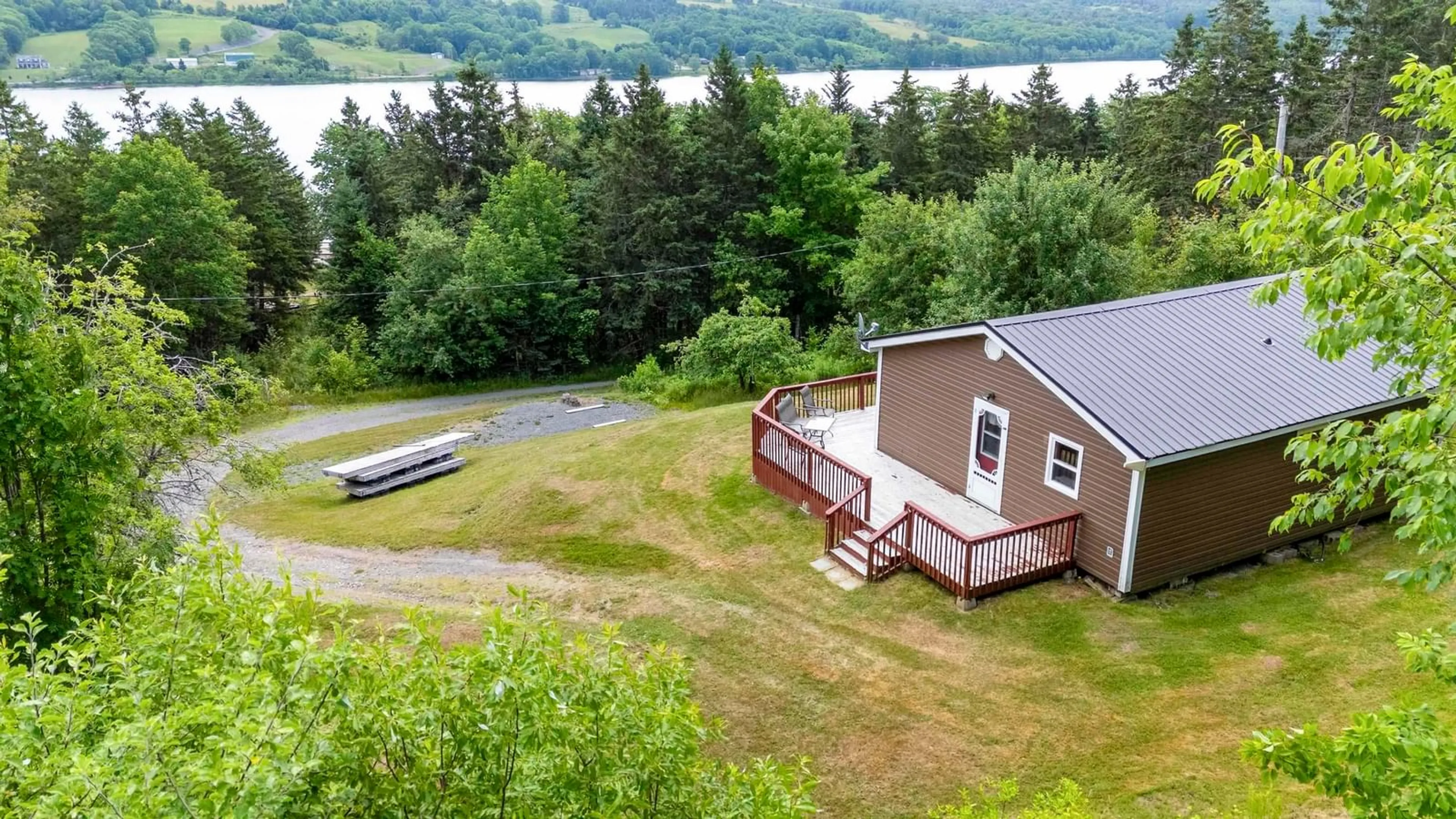 A pic from outside/outdoor area/front of a property/back of a property/a pic from drone, water/lake/river/ocean view for 33 Shine Dr, Lochaber Nova Scotia B2G 2L3