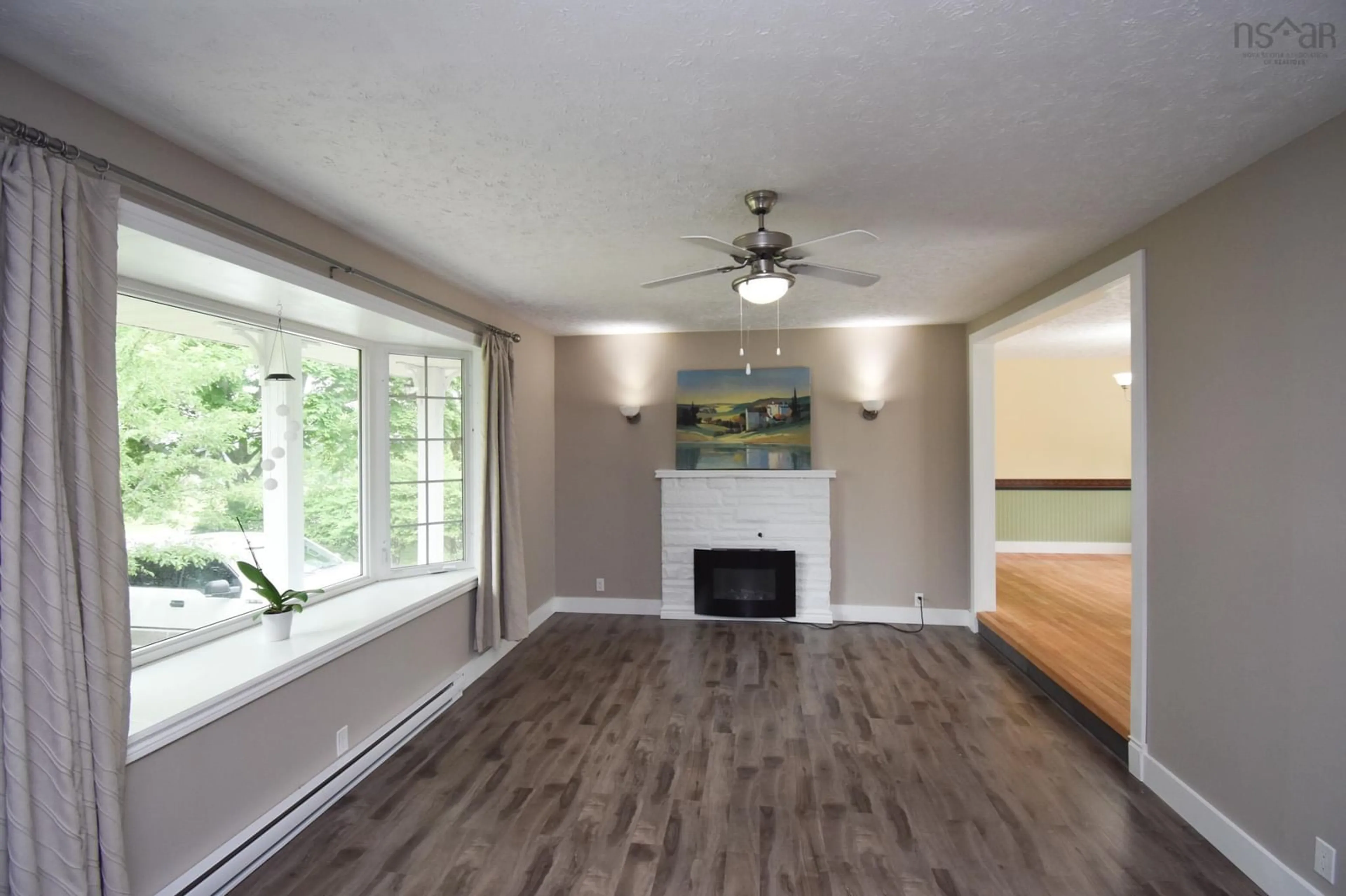 Living room with furniture, wood/laminate floor for 33 Mount Pleasant Blvd, Truro Nova Scotia B2N 3N6