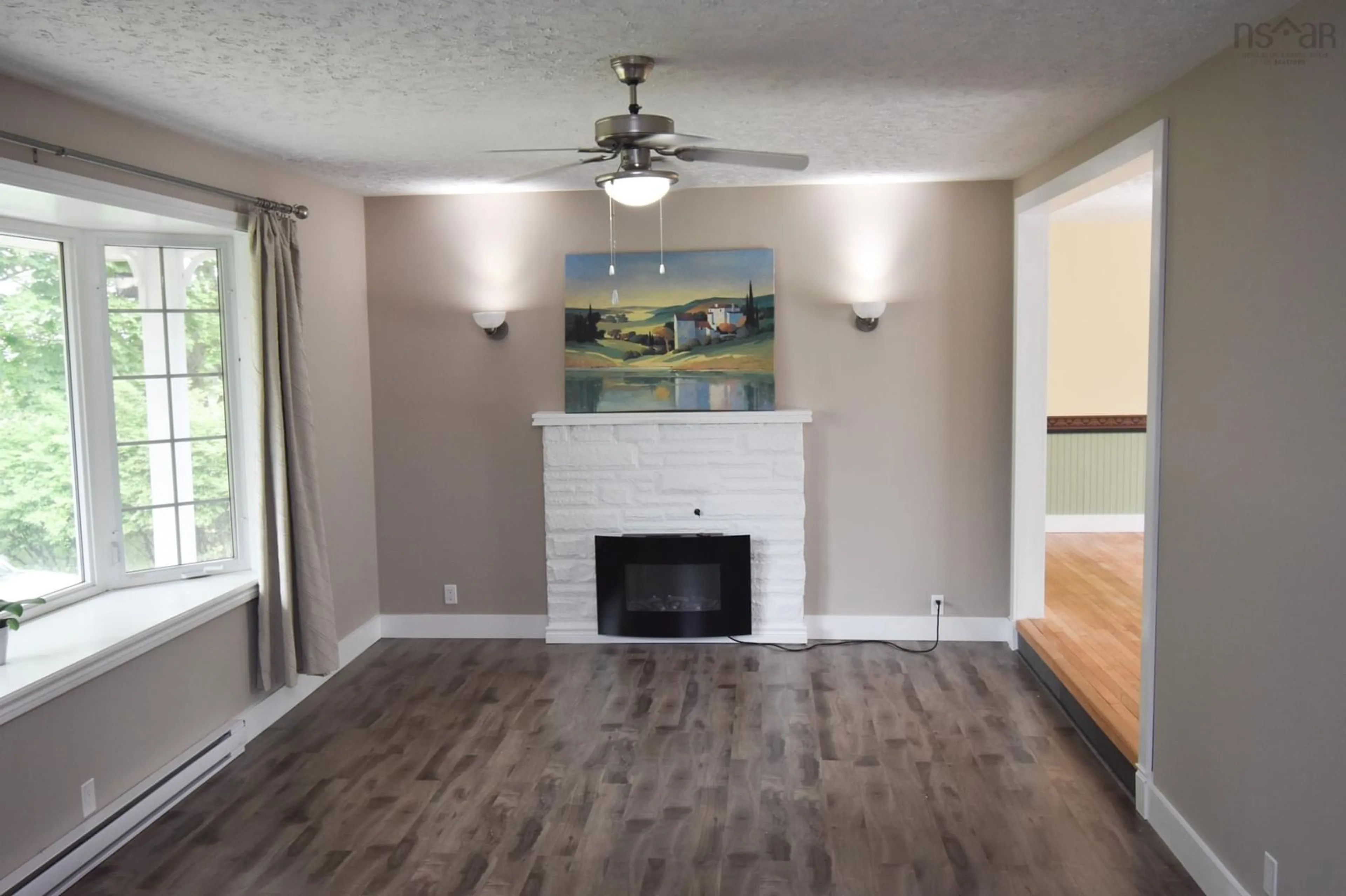 Living room with furniture, wood/laminate floor for 33 Mount Pleasant Blvd, Truro Nova Scotia B2N 3N6