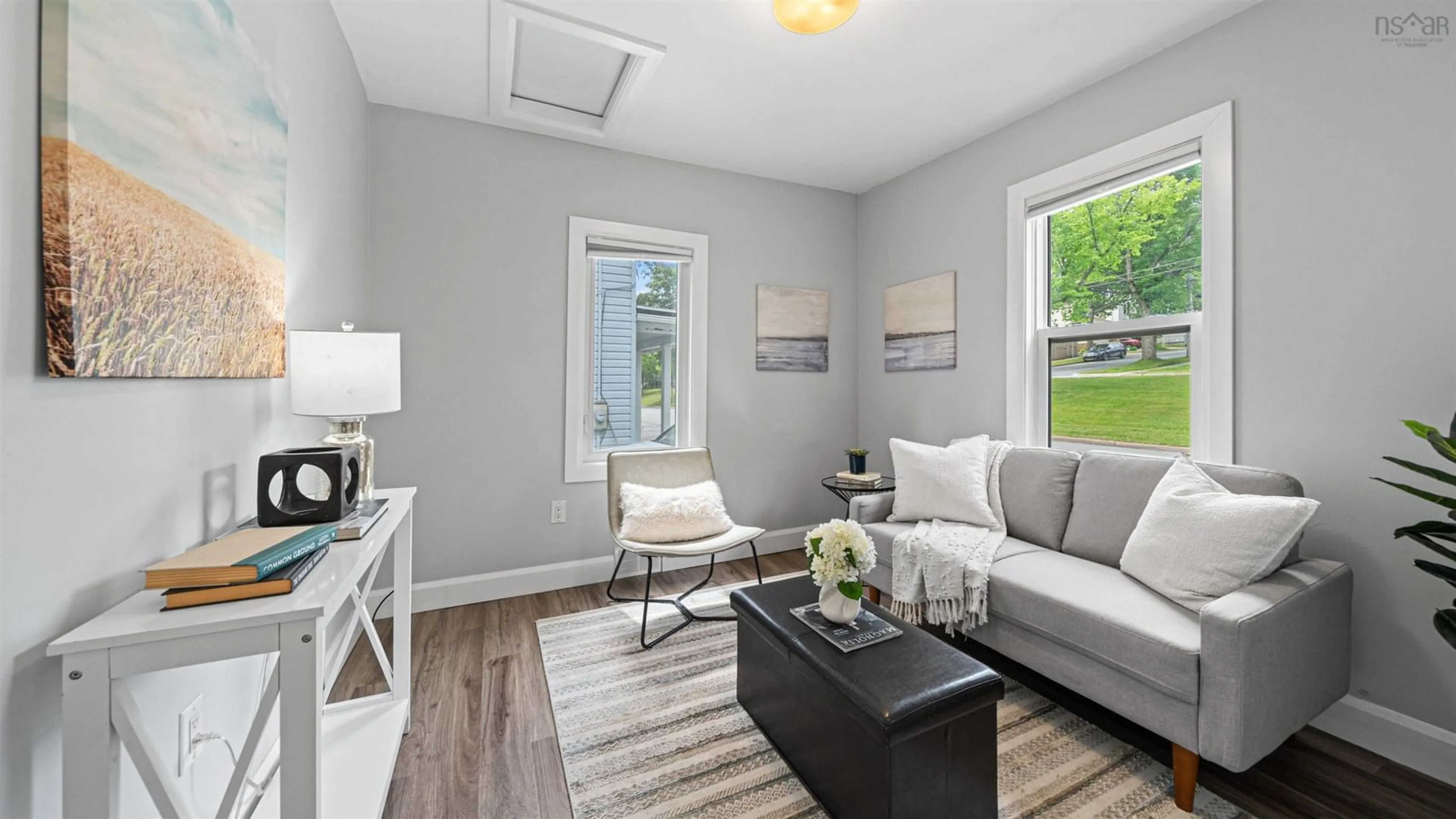 Living room with furniture, wood/laminate floor for 3347 Agricola St, North End Nova Scotia B3K 4H8