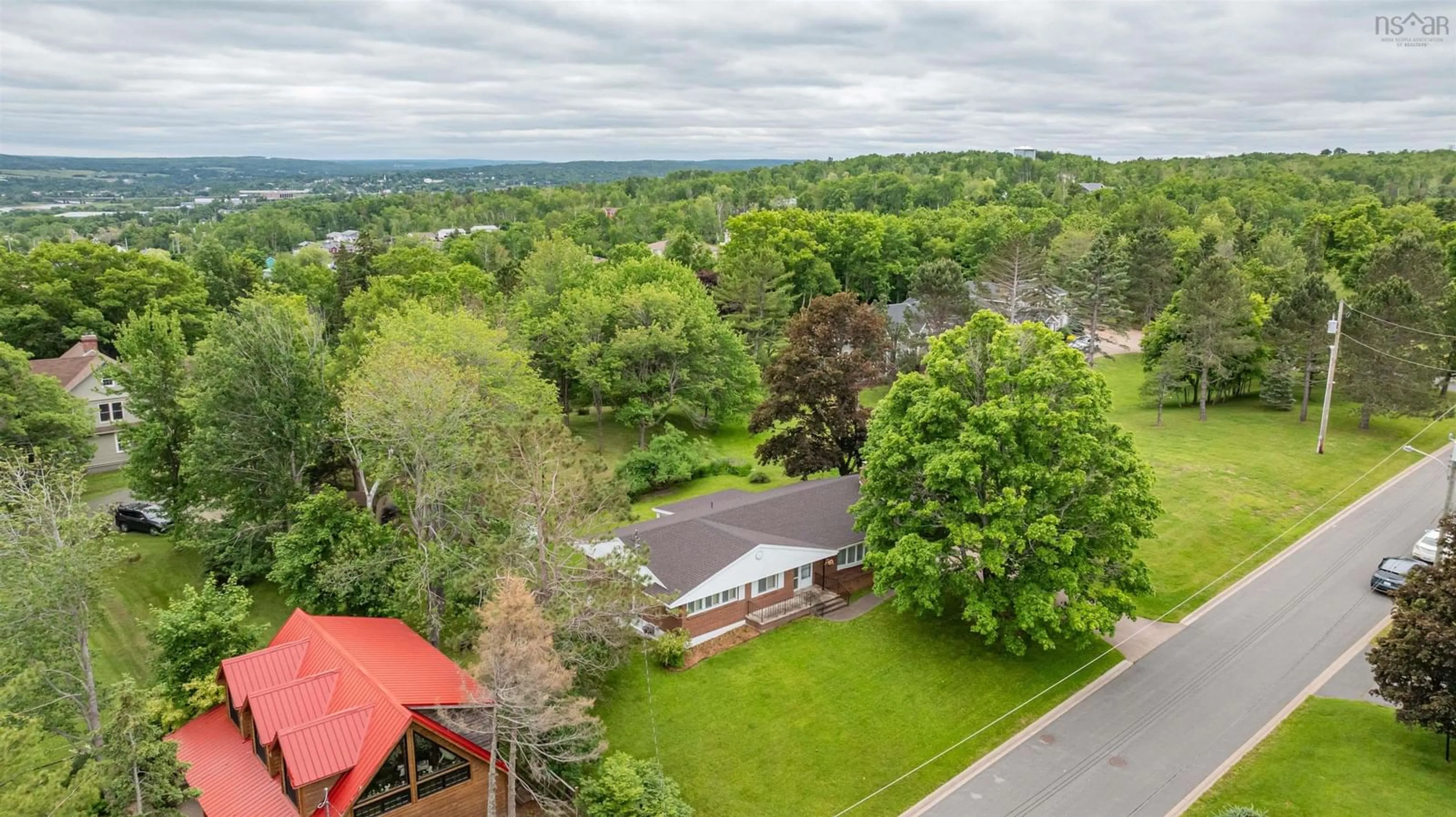 A pic from outside/outdoor area/front of a property/back of a property/a pic from drone, mountain view for 260 Linden Ave, New Glasgow Nova Scotia B2H 2A7