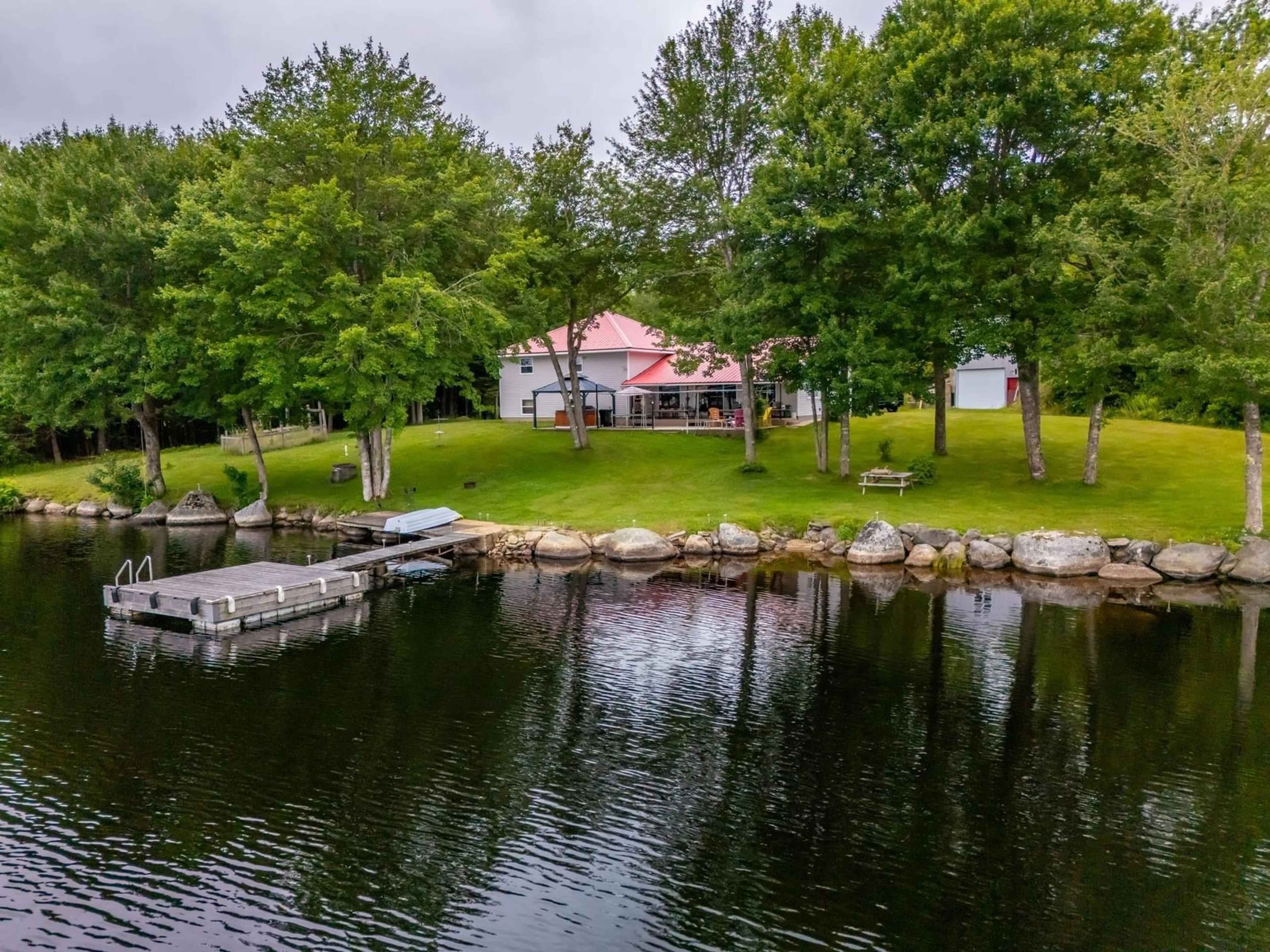 A pic from outside/outdoor area/front of a property/back of a property/a pic from drone, water/lake/river/ocean view for 98 Provost Lake Road, Riverdale Nova Scotia B0W 3T0