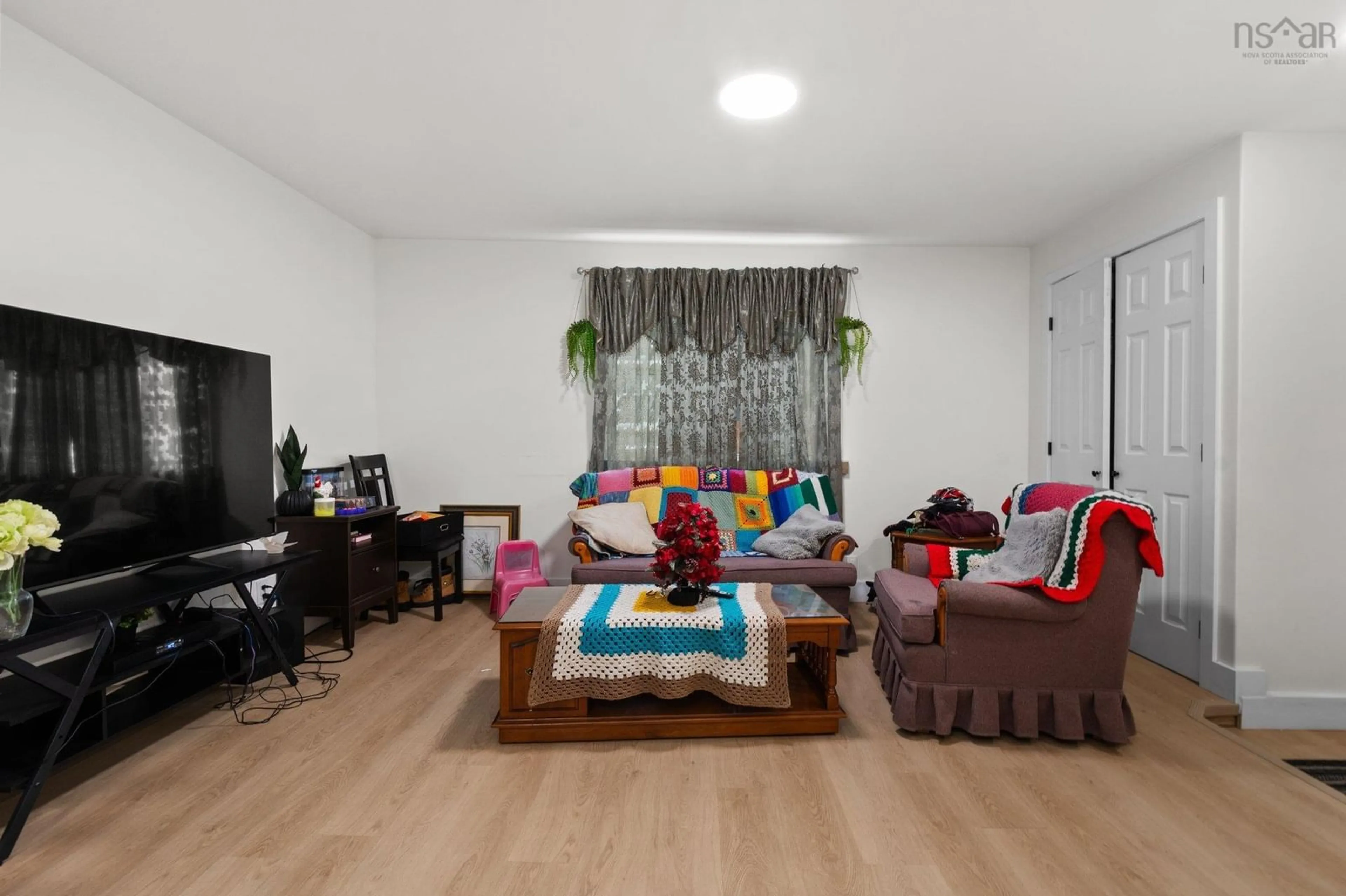 Living room with furniture, wood/laminate floor for 2399 Creighton St, Halifax Nova Scotia B3K 3S2