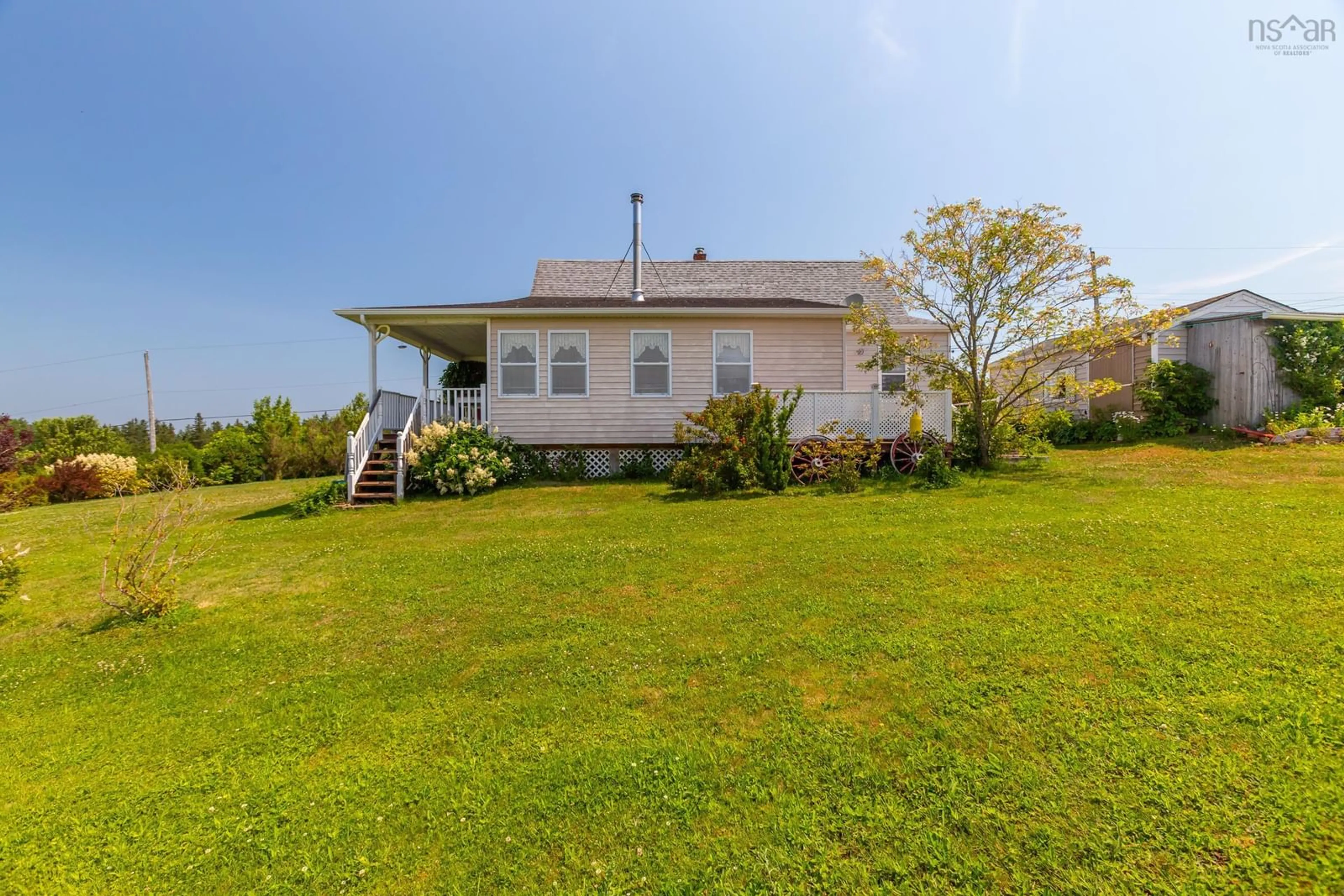 A pic from outside/outdoor area/front of a property/back of a property/a pic from drone, water/lake/river/ocean view for 27 Port Lorne Rd, Mount Rose Nova Scotia B0S 1R0