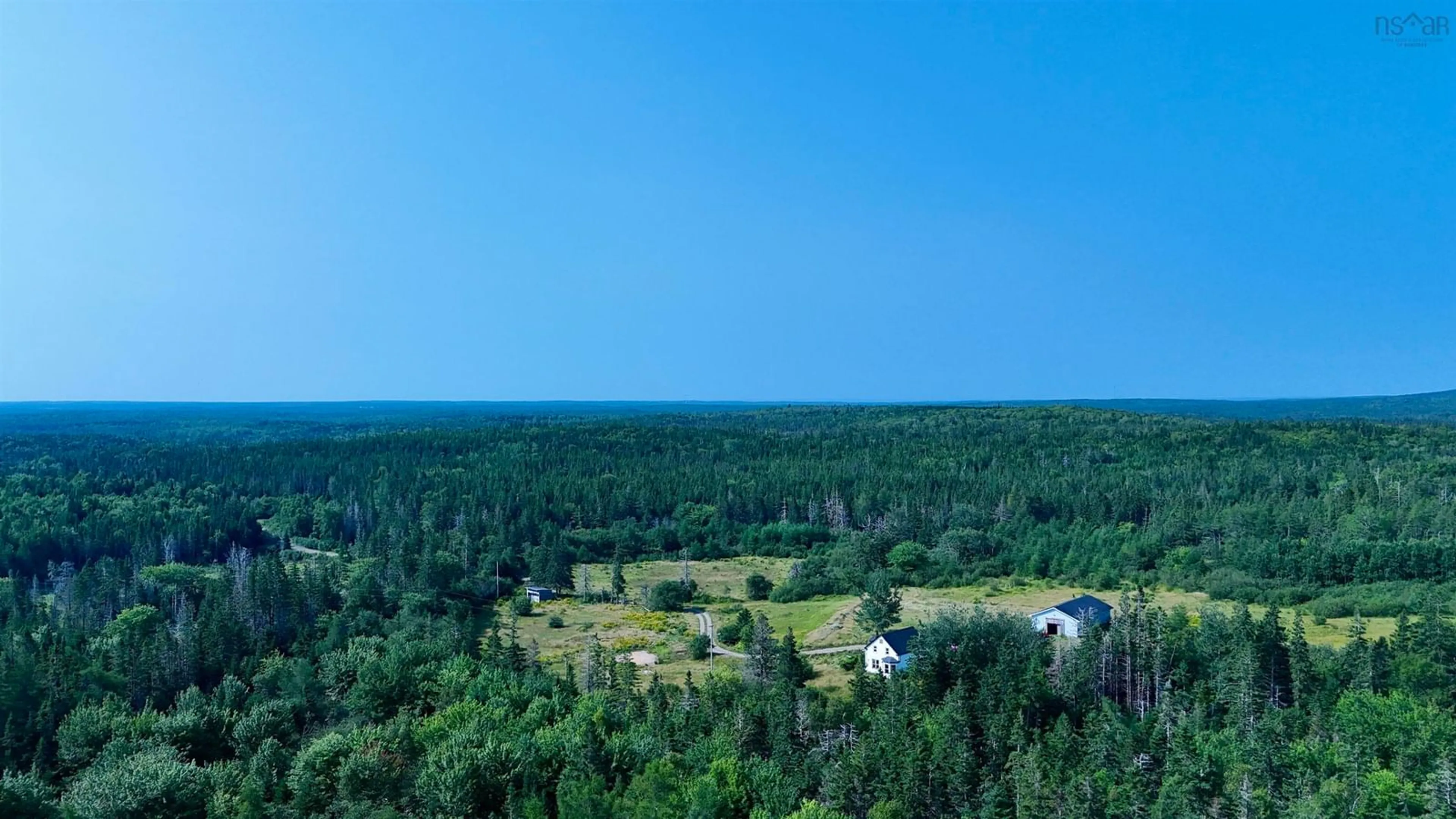 A pic from outside/outdoor area/front of a property/back of a property/a pic from drone, forest/trees view for 1520 Back Rd, River Bourgeois Nova Scotia B0E 2X0