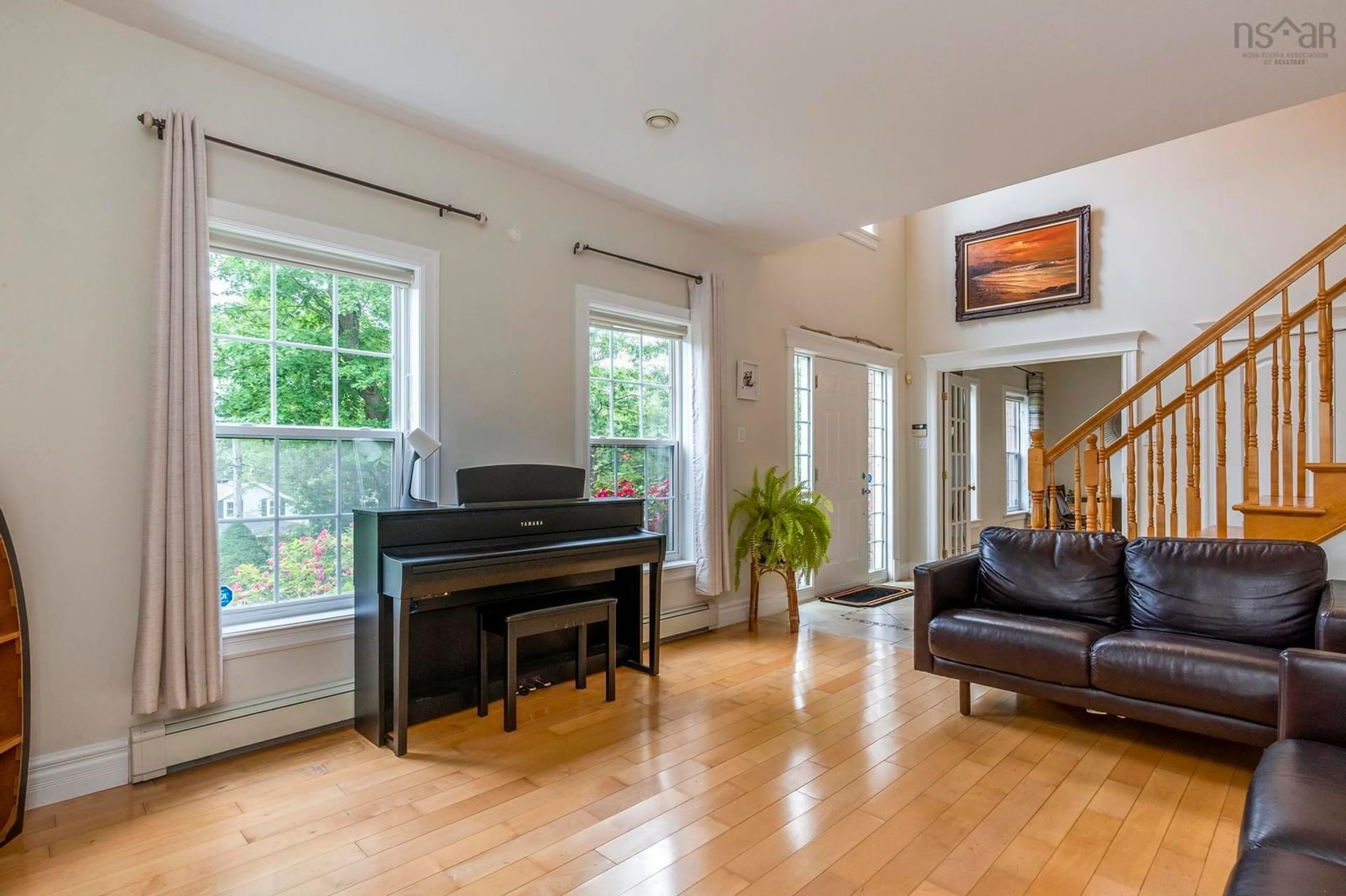 Living room with furniture, wood/laminate floor for 48 Doyle St, Bedford Nova Scotia B4A 1K5