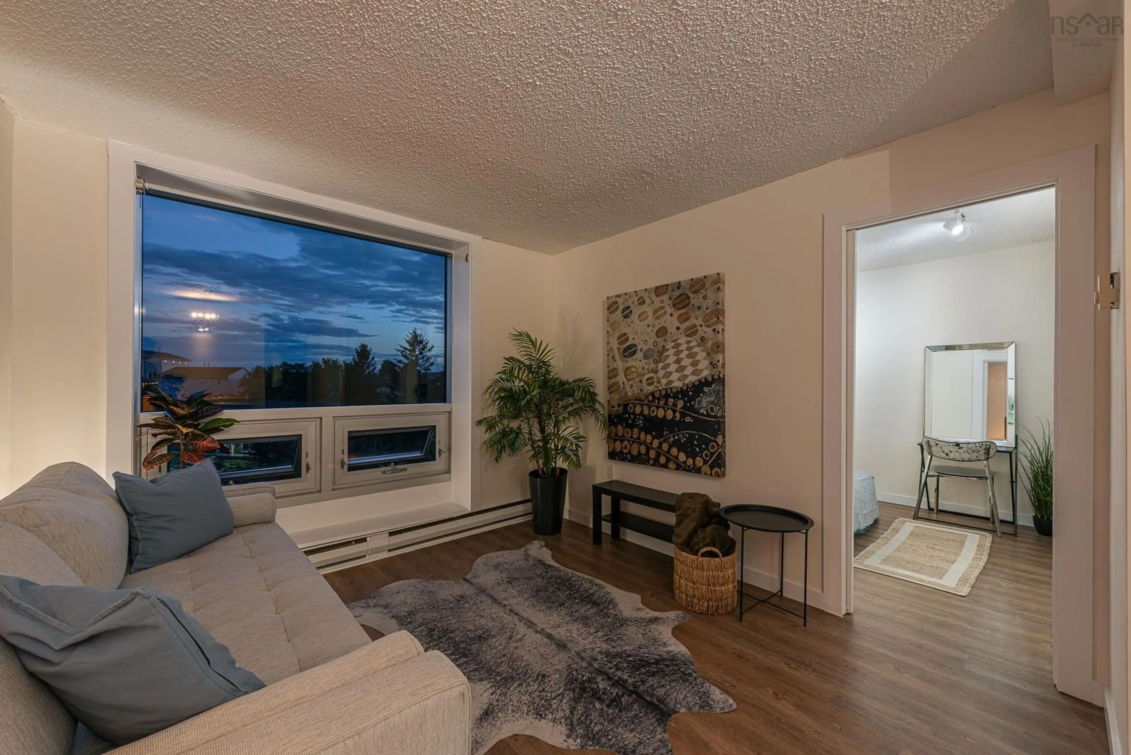Living room with furniture, wood/laminate floor for 5572 North Ridge Rd #405, Halifax Nova Scotia B3K 5K2