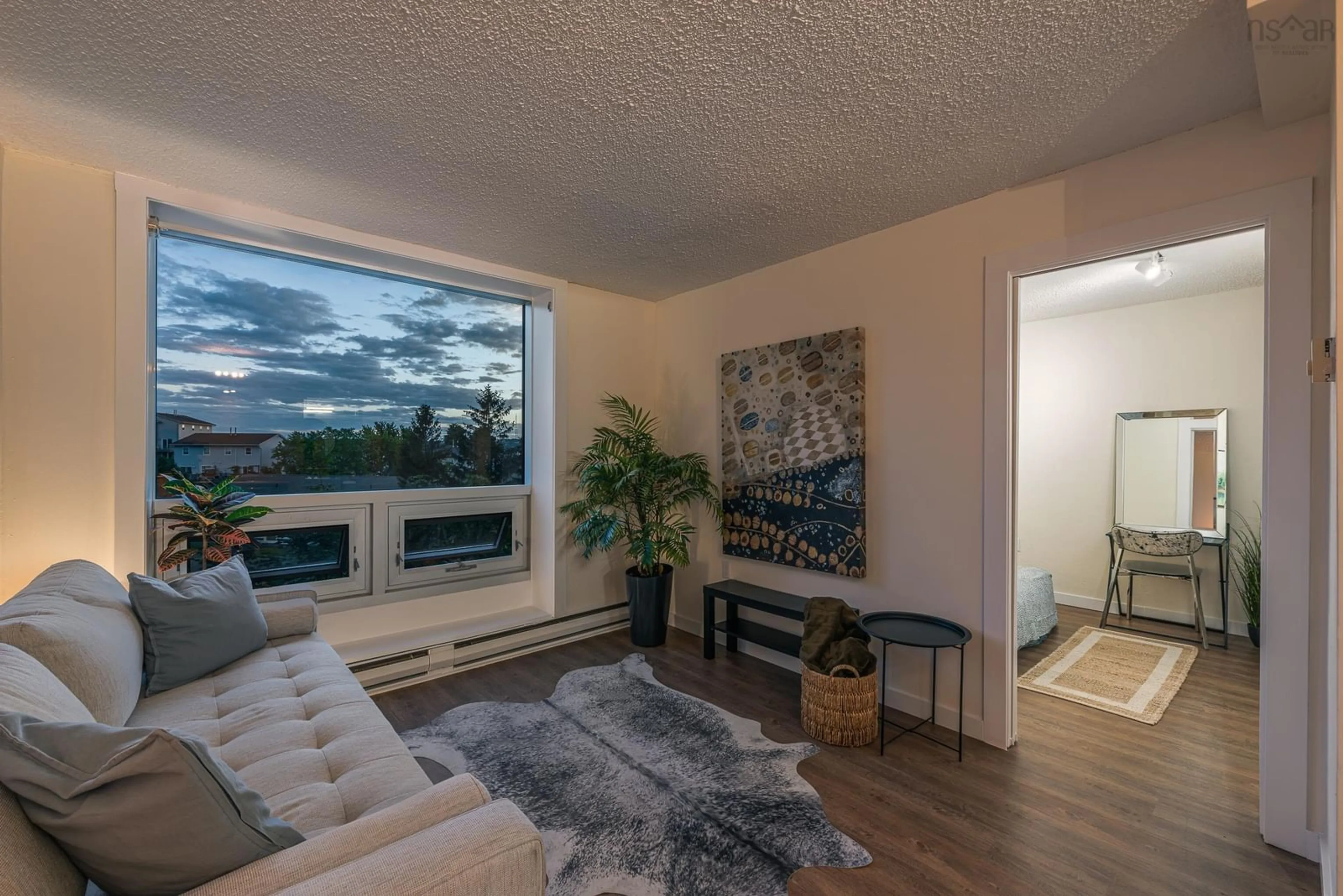 Living room with furniture, wood/laminate floor for 5572 North Ridge Rd #405, Halifax Nova Scotia B3K 5K2