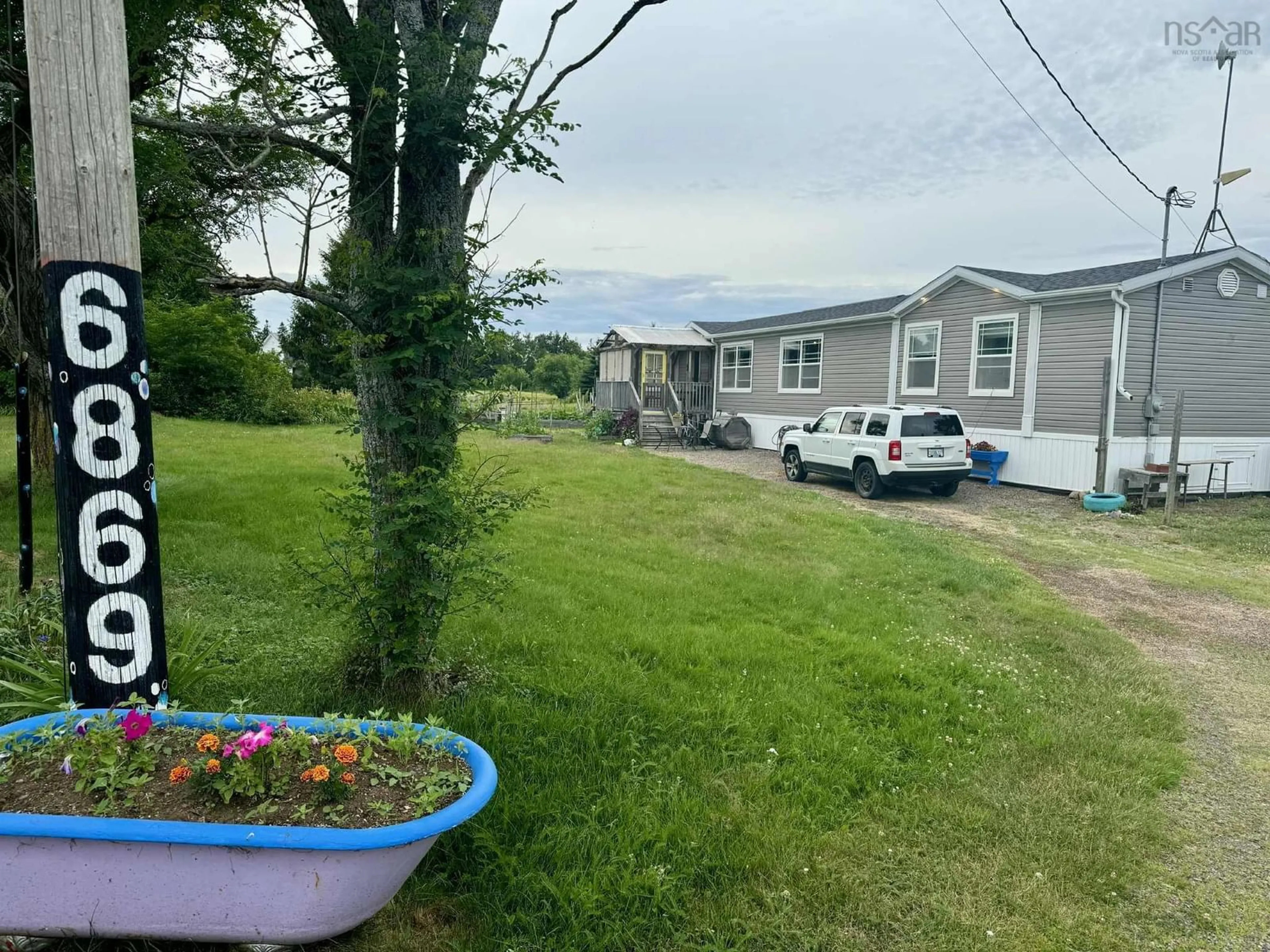 A pic from outside/outdoor area/front of a property/back of a property/a pic from drone, mountain view for 6869 Highway 2, Bass River Nova Scotia B0M 1R0
