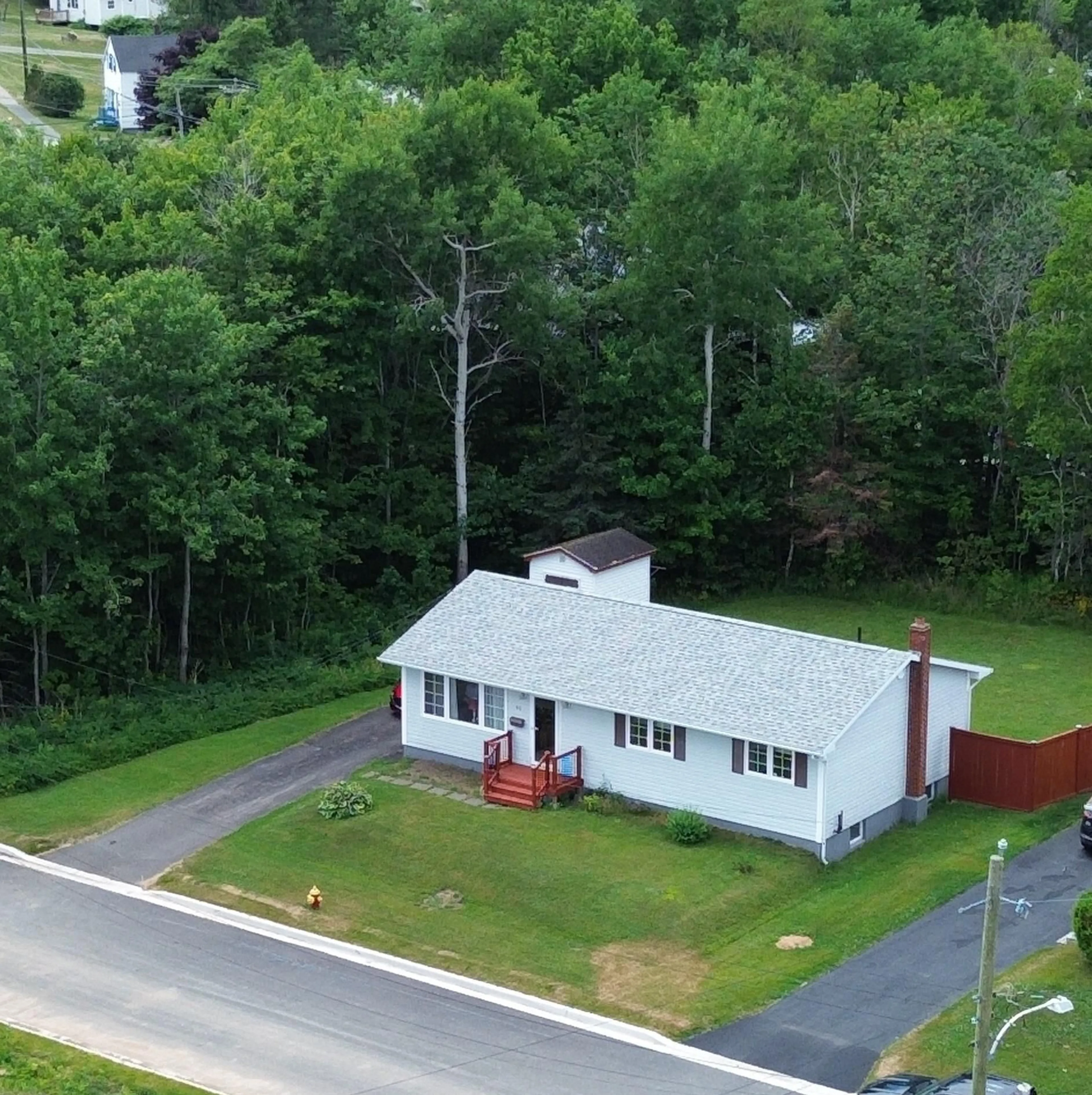 A pic from outside/outdoor area/front of a property/back of a property/a pic from drone, unknown for 18 Pat St, Sydney Nova Scotia B1S 2L4