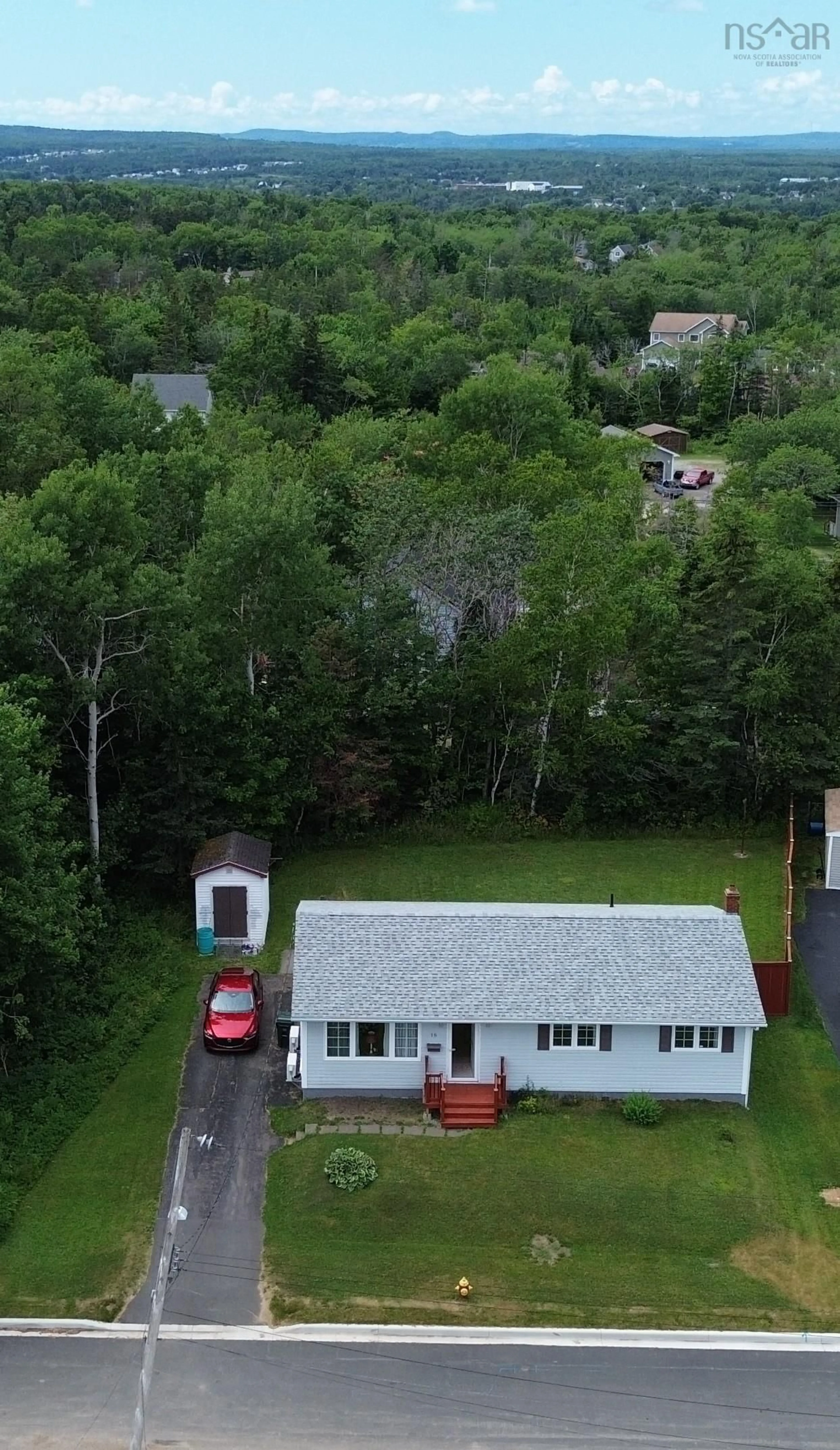 A pic from outside/outdoor area/front of a property/back of a property/a pic from drone, unknown for 18 Pat St, Sydney Nova Scotia B1S 2L4