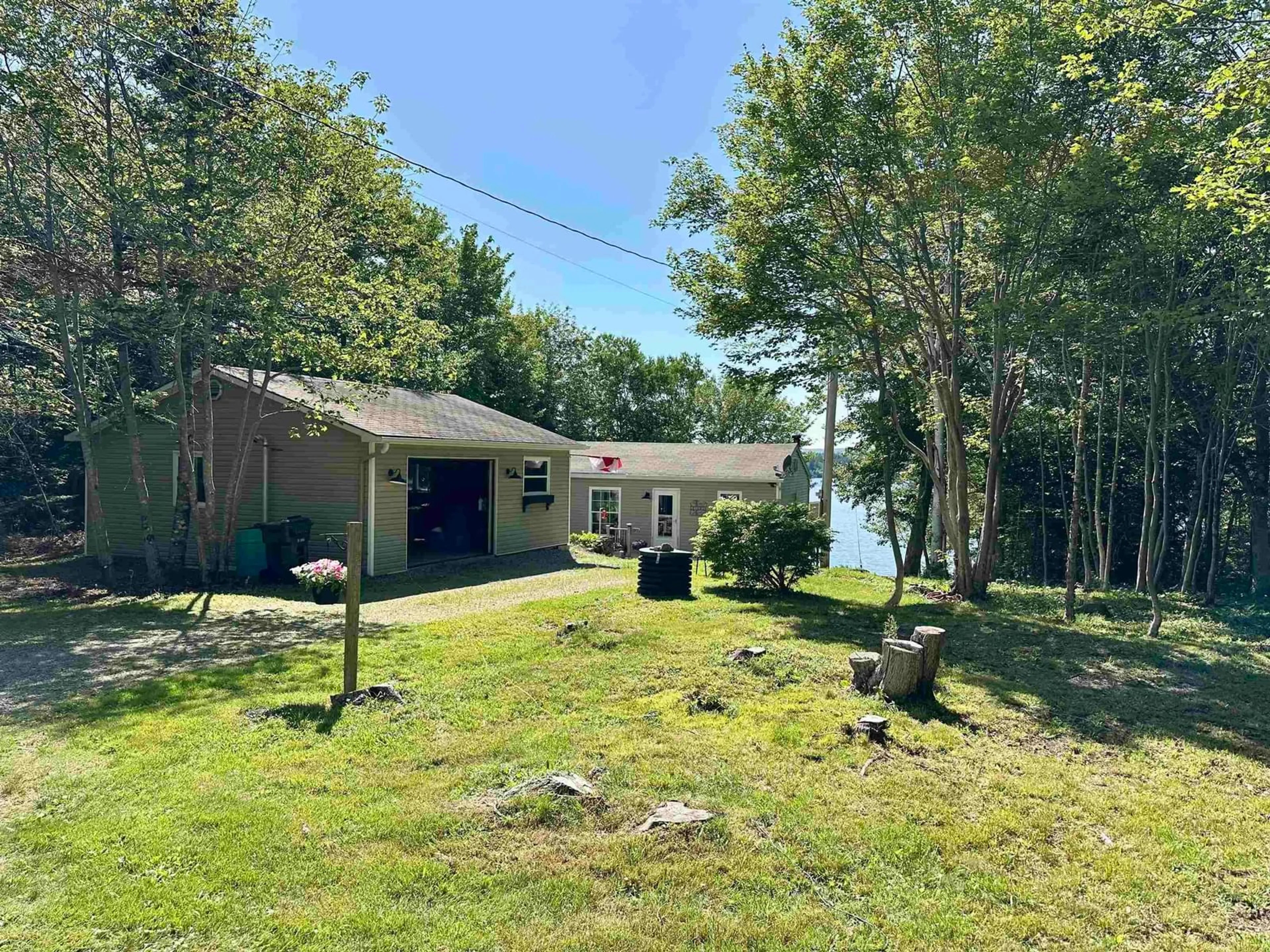 A pic from outside/outdoor area/front of a property/back of a property/a pic from drone, water/lake/river/ocean view for 1458 Grand Mira South Rd, Grand Mira South Nova Scotia B1K 1H2