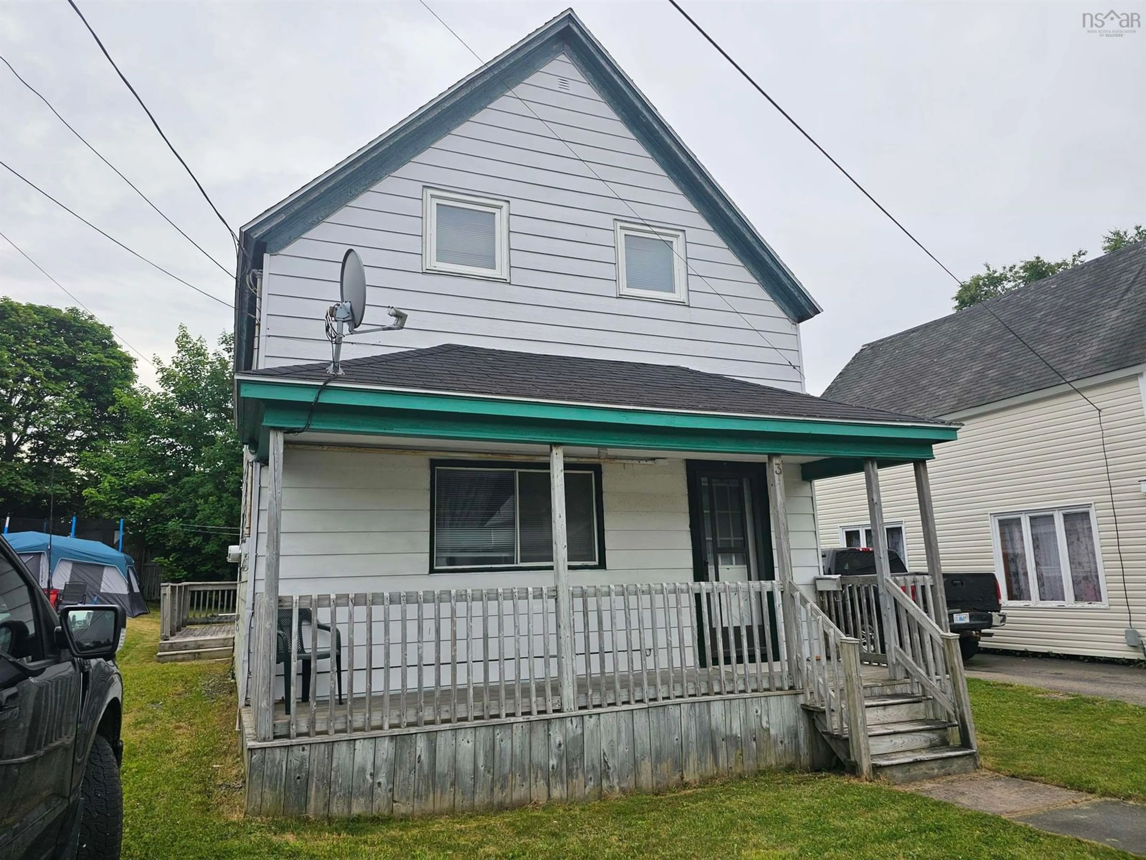 Home with vinyl exterior material, street for 3 Thompson Ave, North Sydney Nova Scotia B2A 1X7