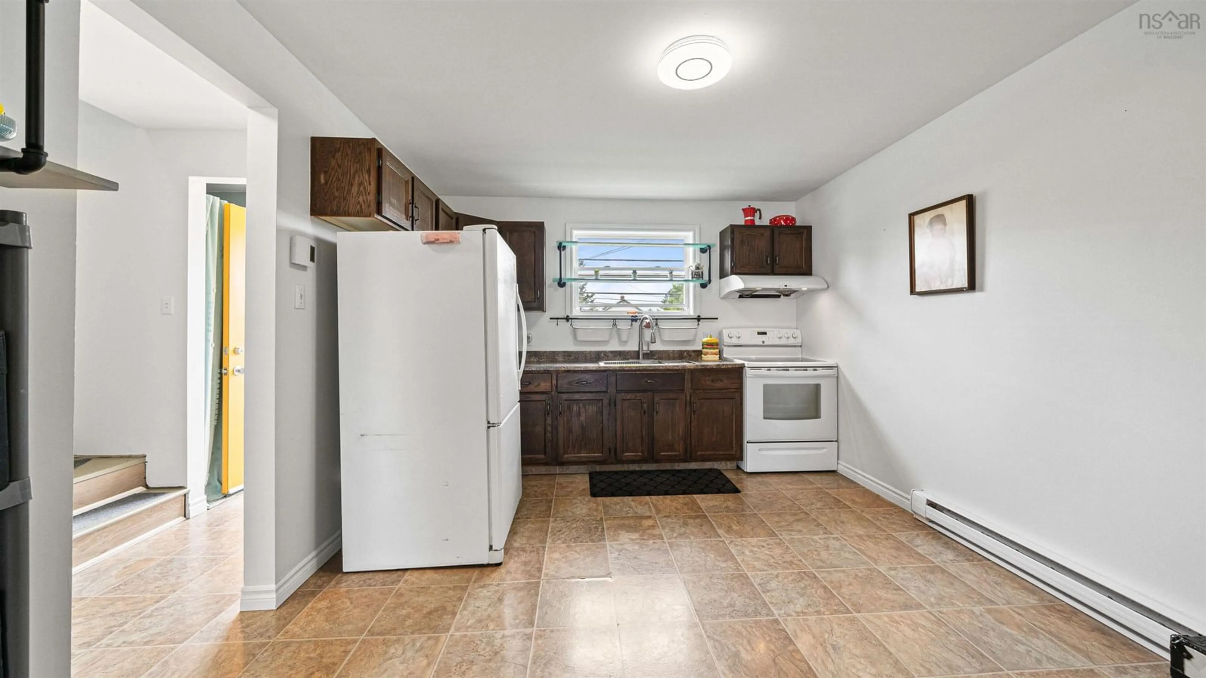 Standard kitchen, ceramic/tile floor for 144 Cow Bay Rd, Eastern Passage Nova Scotia B3G 1C2