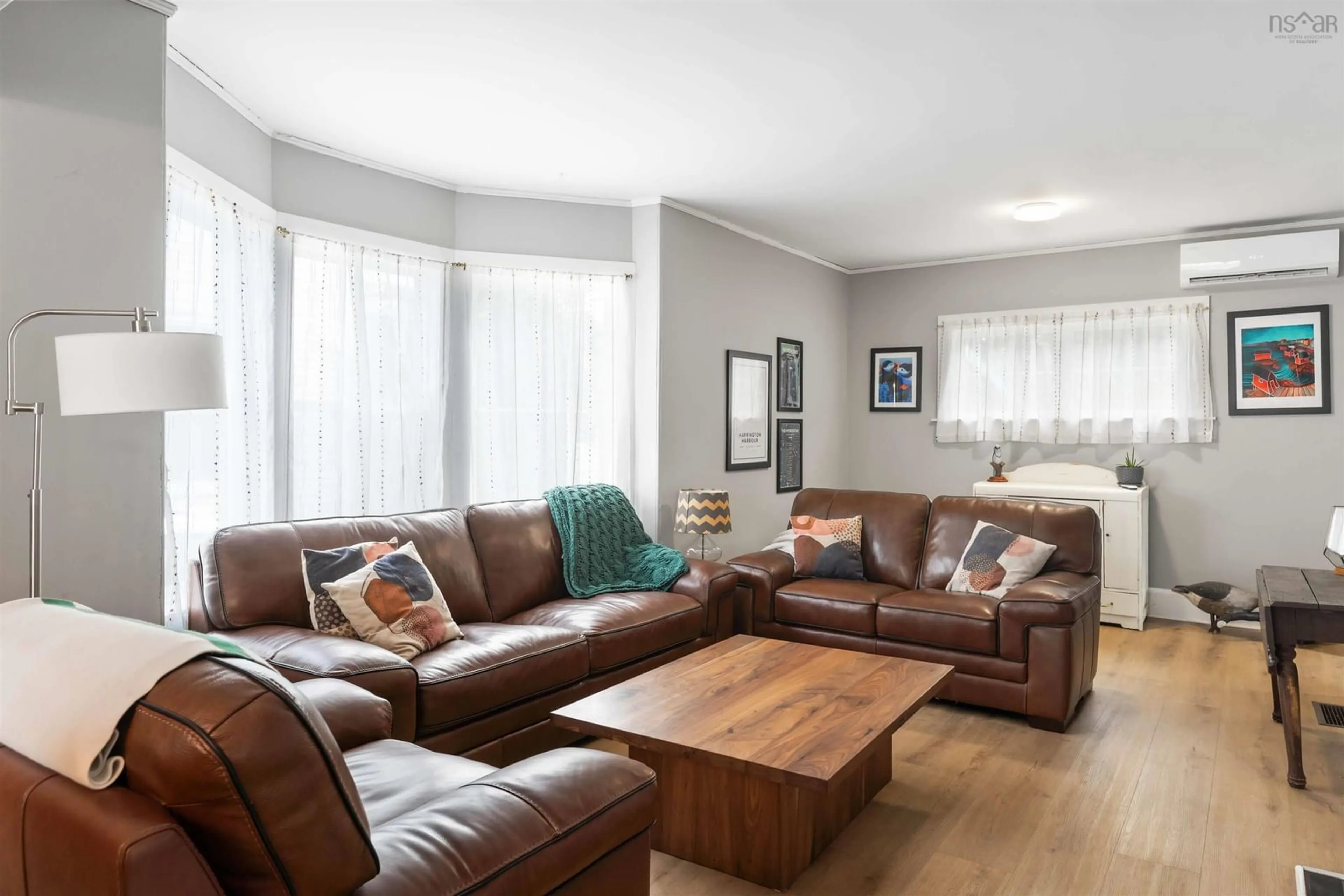 Living room with furniture, wood/laminate floor for 22 Washington St, Bridgetown Nova Scotia B0S 1C0