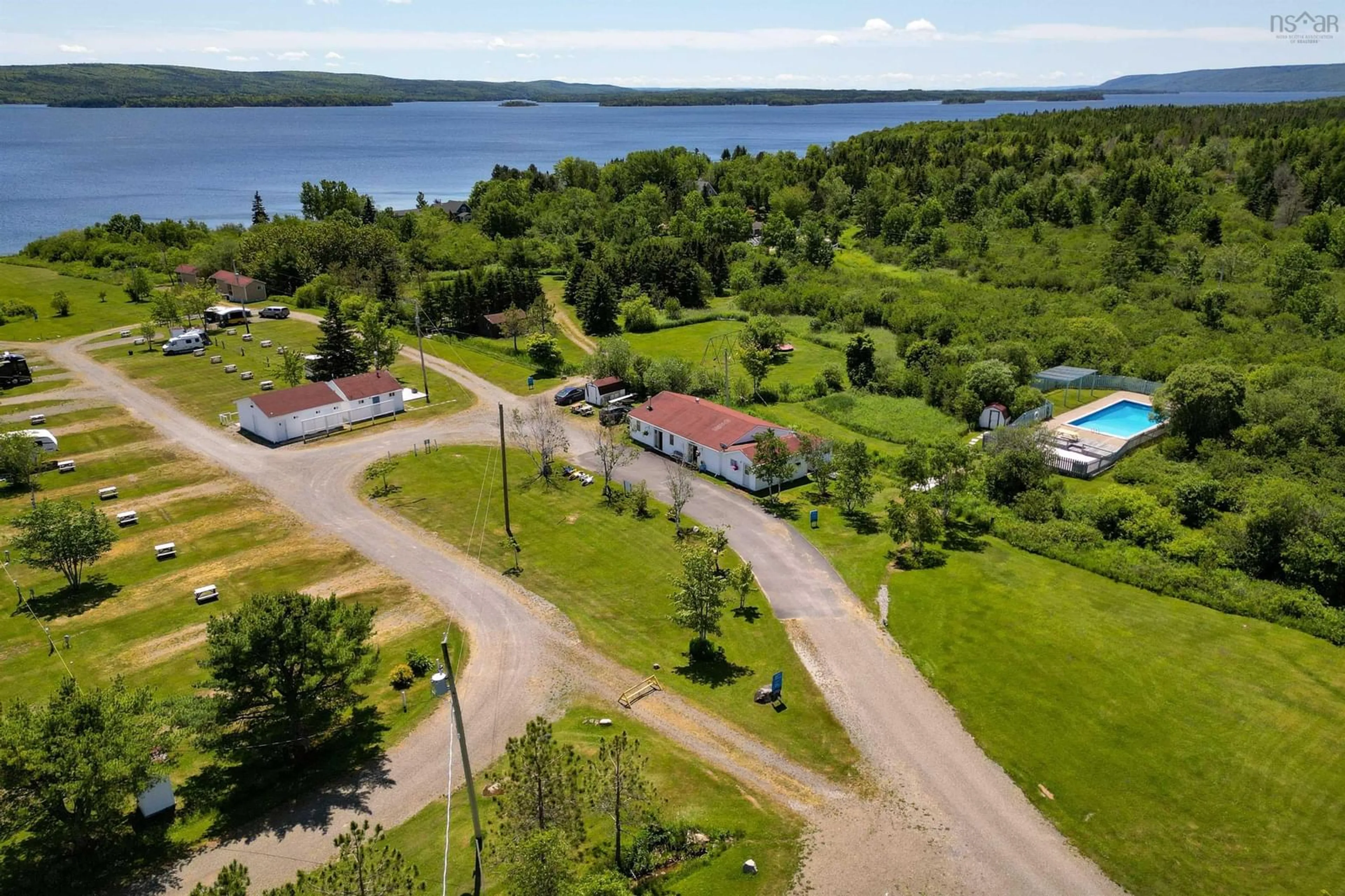 A pic from outside/outdoor area/front of a property/back of a property/a pic from drone, water/lake/river/ocean view for 8885 Highway 105, Baddeck Inlet Nova Scotia B0E 1B0