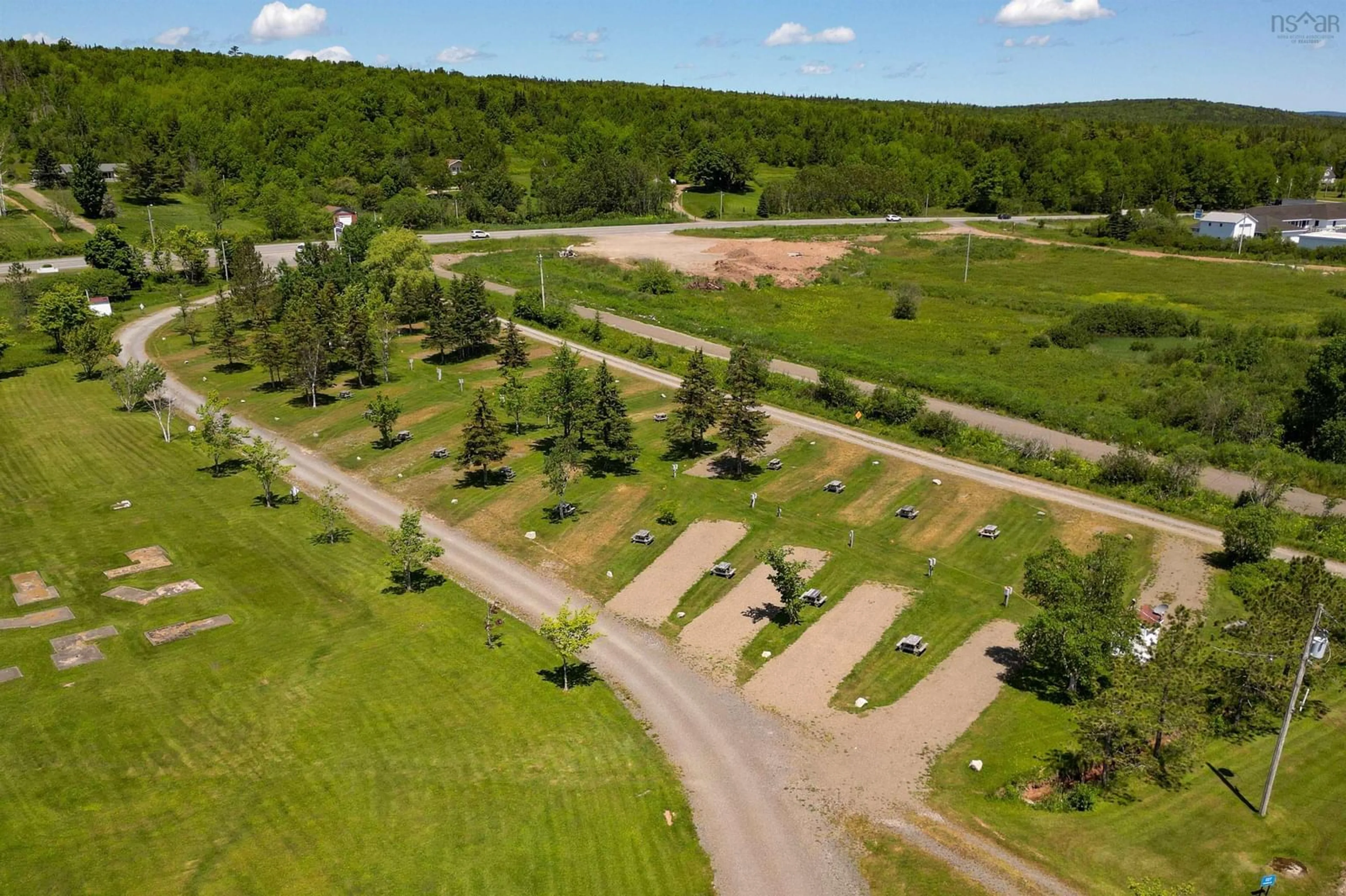 A pic from outside/outdoor area/front of a property/back of a property/a pic from drone, forest/trees view for 8885 Highway 105, Baddeck Inlet Nova Scotia B0E 1B0