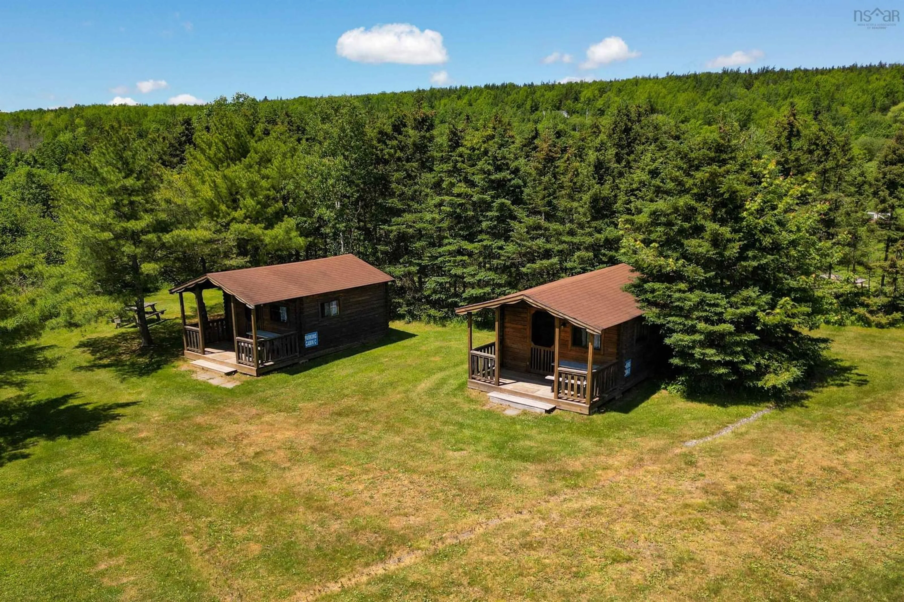 A pic from outside/outdoor area/front of a property/back of a property/a pic from drone, forest/trees view for 8885 Highway 105, Baddeck Inlet Nova Scotia B0E 1B0