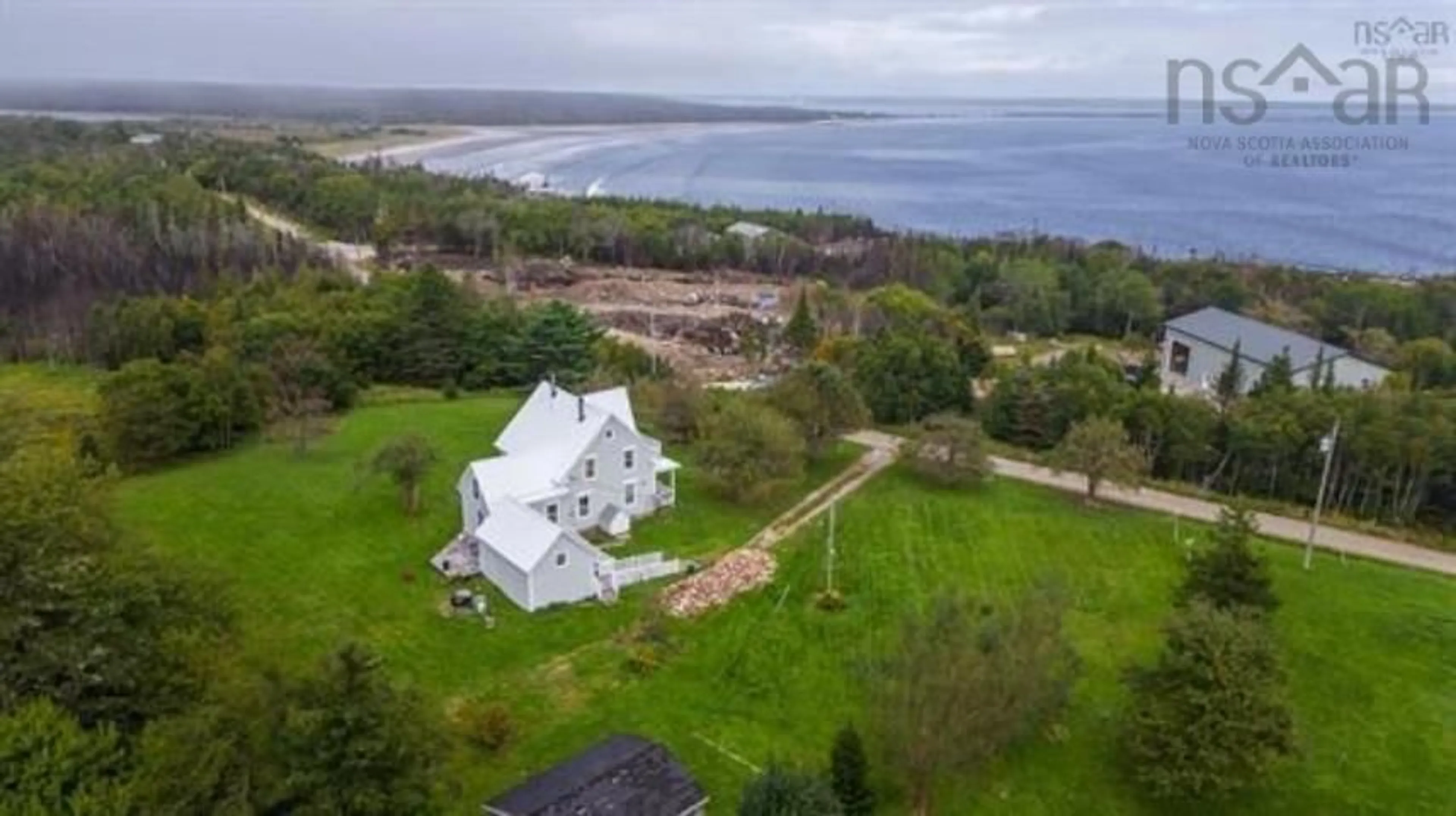 A pic from outside/outdoor area/front of a property/back of a property/a pic from drone, water/lake/river/ocean view for 171 Round Bay Ferry Rd, Round Bay Nova Scotia B0T 1W0