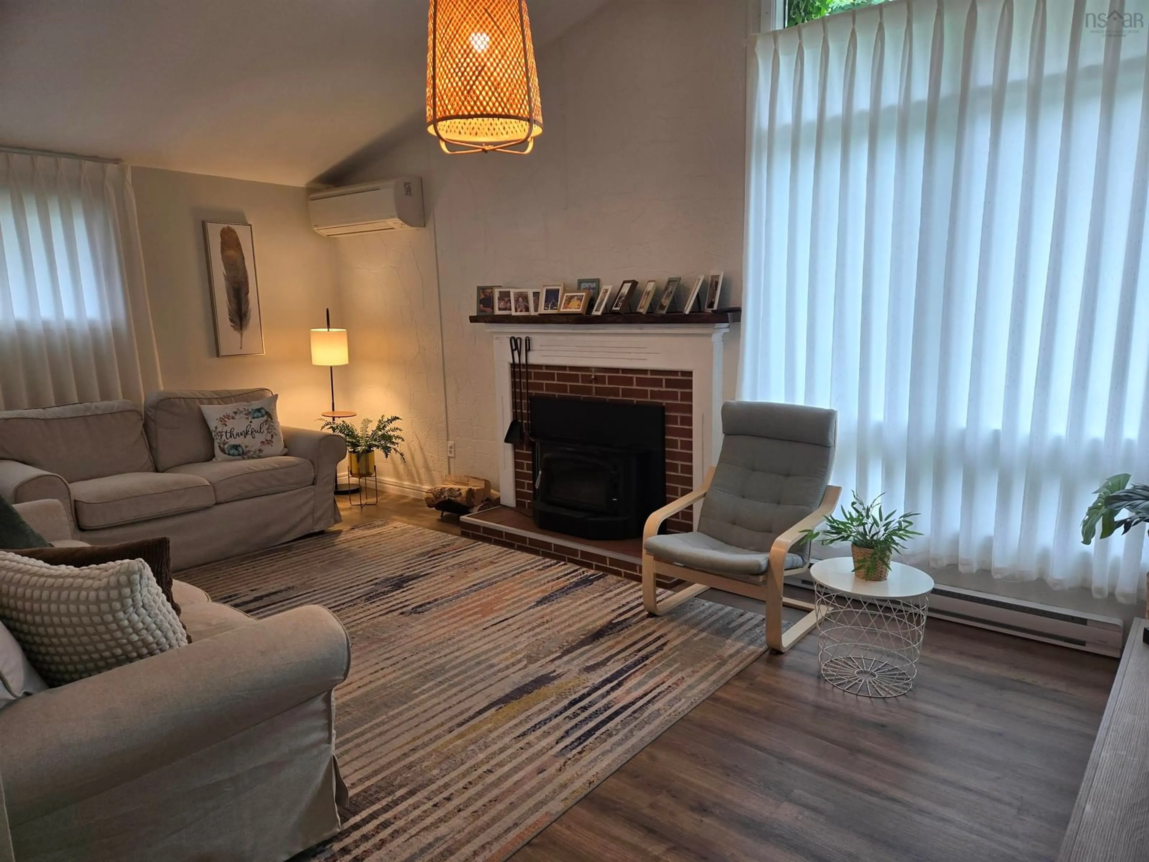 Living room with furniture, wood/laminate floor for 32 Murray Dr, Bridgewater Nova Scotia B4V 2M7