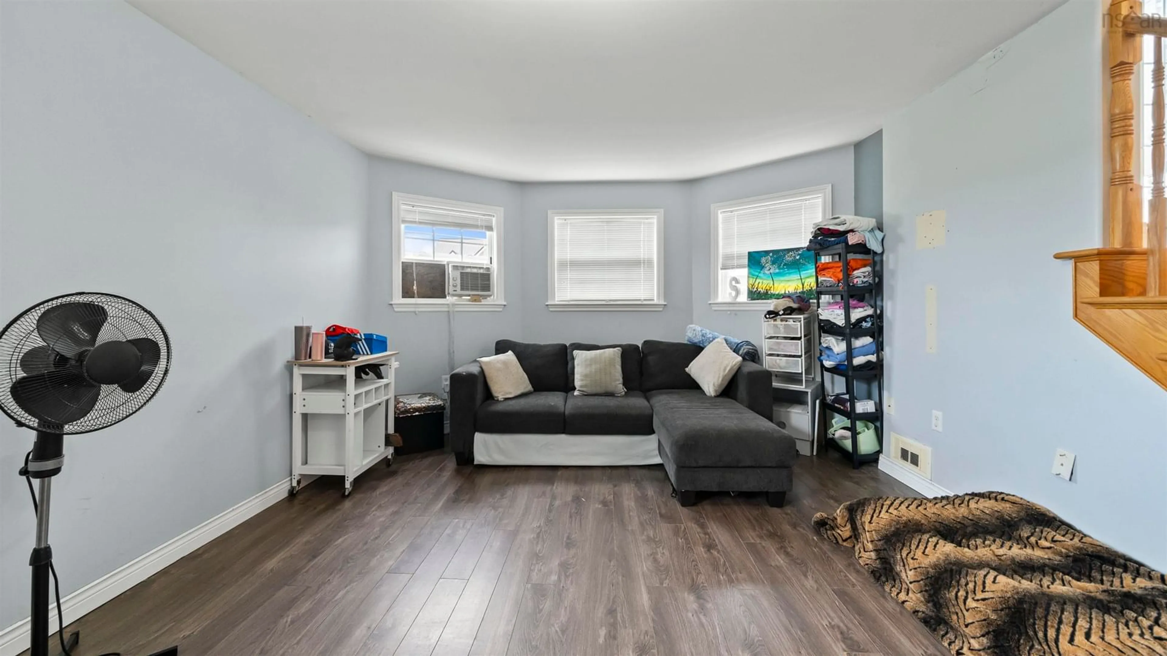 Living room with furniture, wood/laminate floor for 18 Coburg Cres, Truro Nova Scotia B2N 7J6