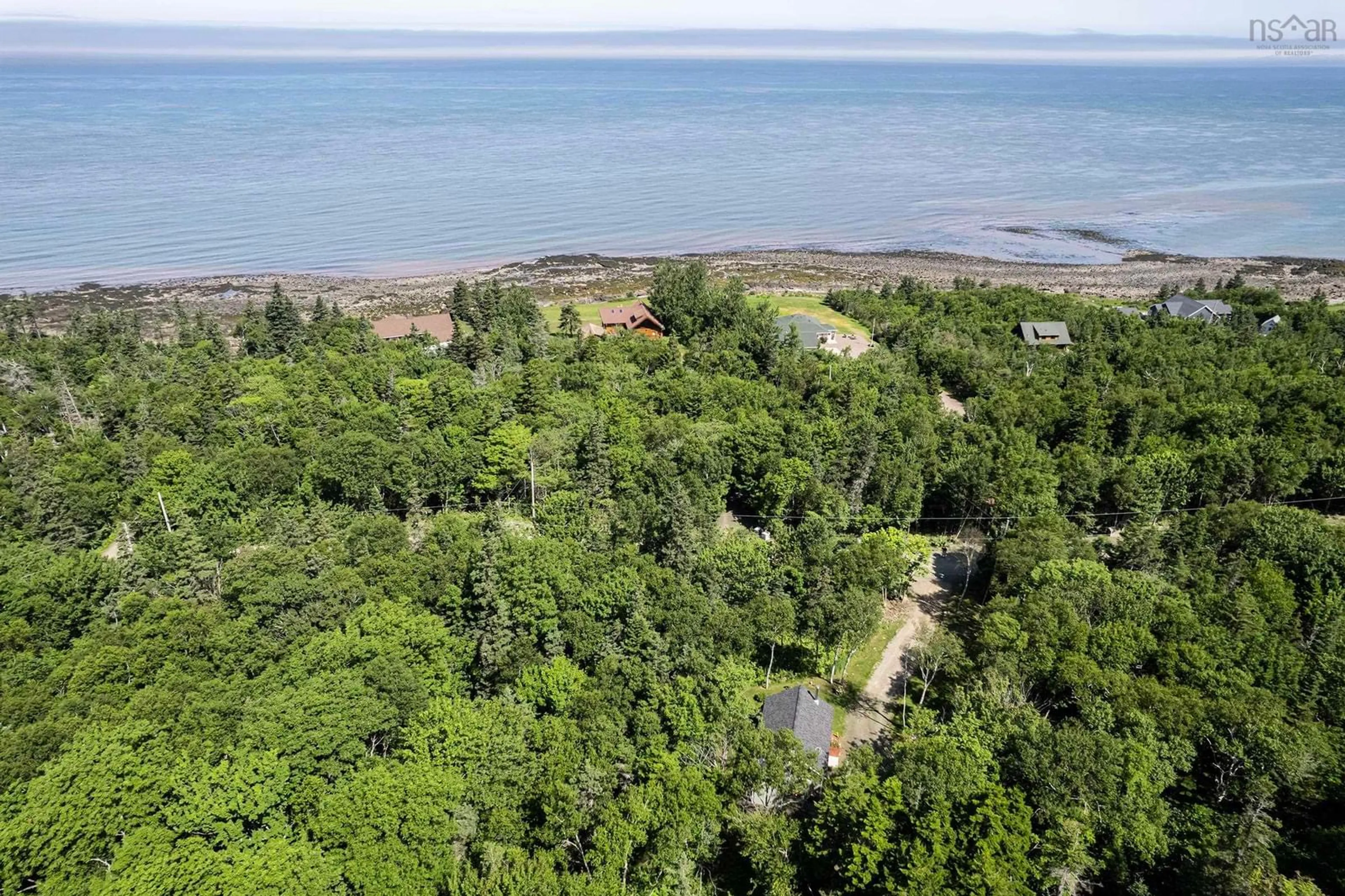 A pic from outside/outdoor area/front of a property/back of a property/a pic from drone, water/lake/river/ocean view for 11484 Shore Rd, Mount Hanley Nova Scotia B0S 1P0