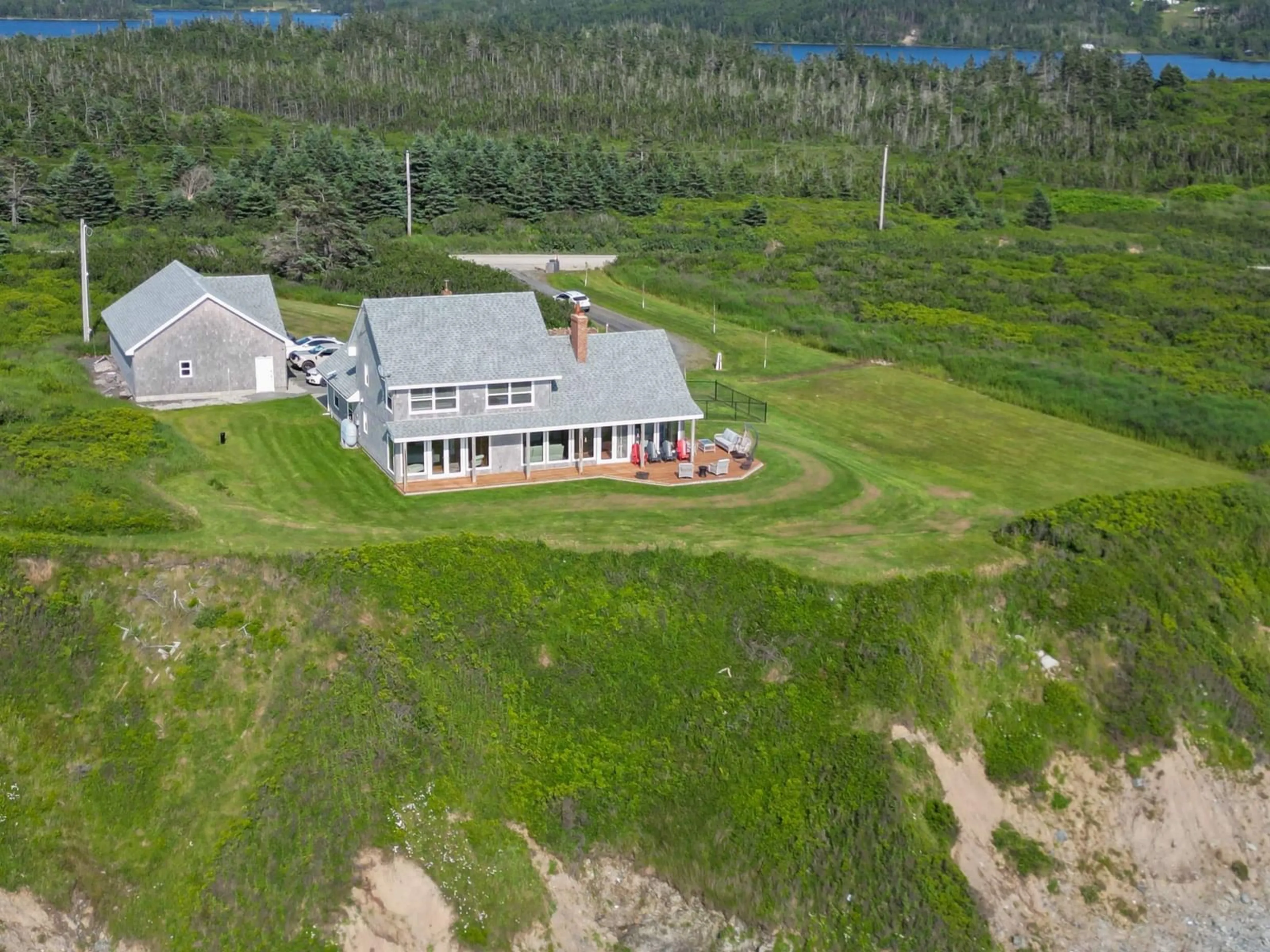 A pic from outside/outdoor area/front of a property/back of a property/a pic from drone, water/lake/river/ocean view for 2435 Main Shore Rd, Port Maitland Nova Scotia B5A 5V1
