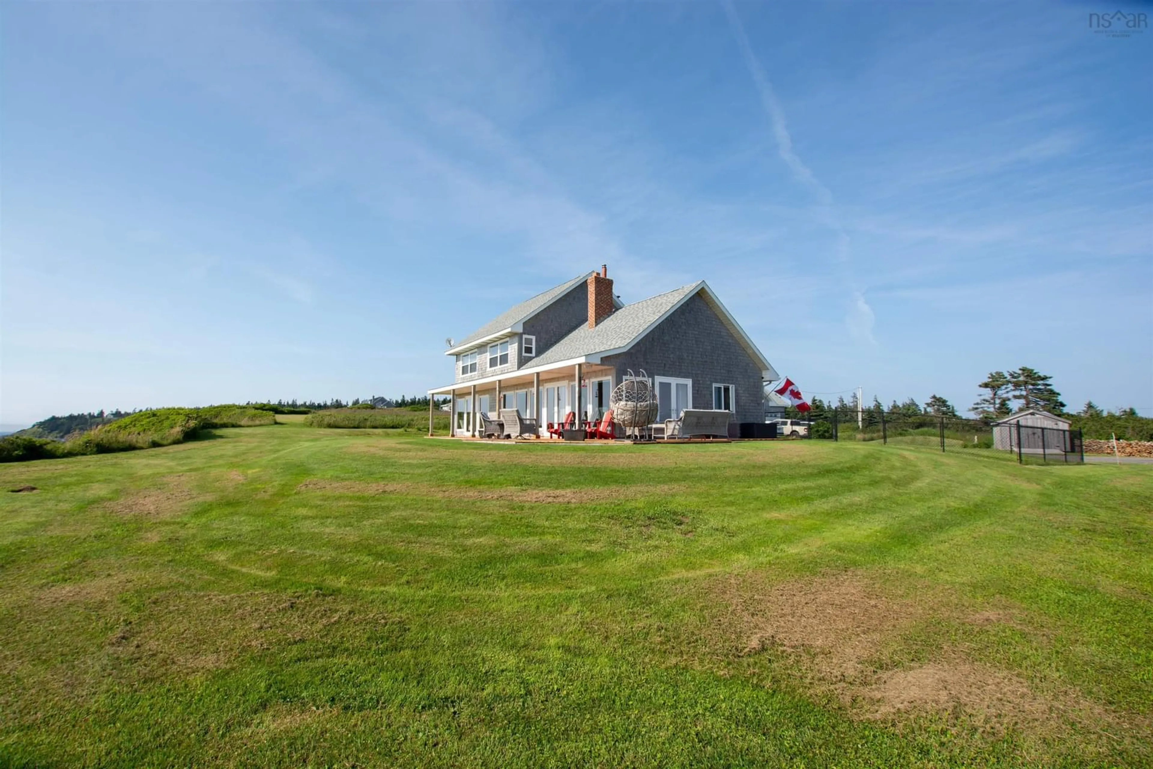 A pic from outside/outdoor area/front of a property/back of a property/a pic from drone, water/lake/river/ocean view for 2435 Main Shore Rd, Port Maitland Nova Scotia B5A 5V1
