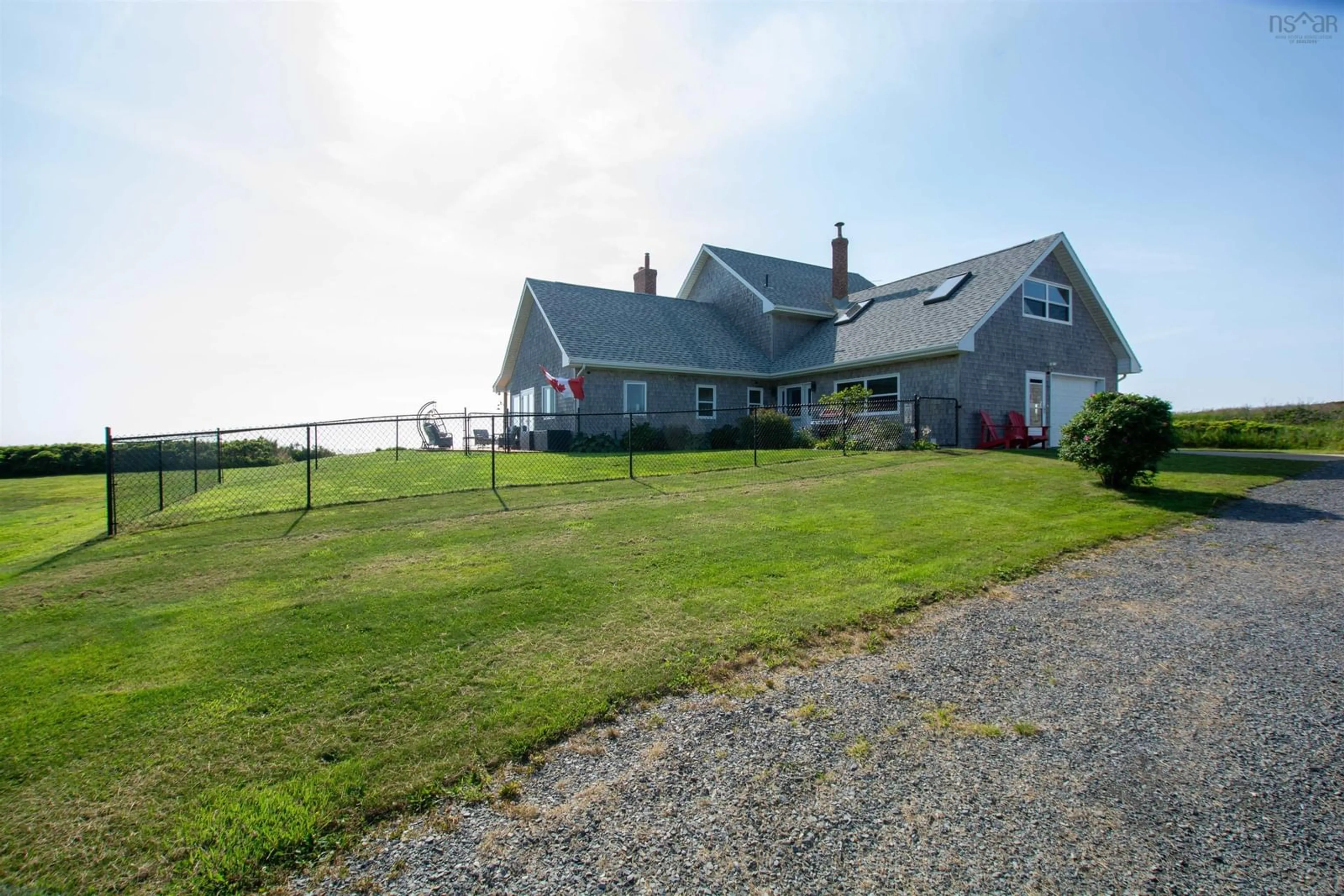 A pic from outside/outdoor area/front of a property/back of a property/a pic from drone, water/lake/river/ocean view for 2435 Main Shore Rd, Port Maitland Nova Scotia B5A 5V1
