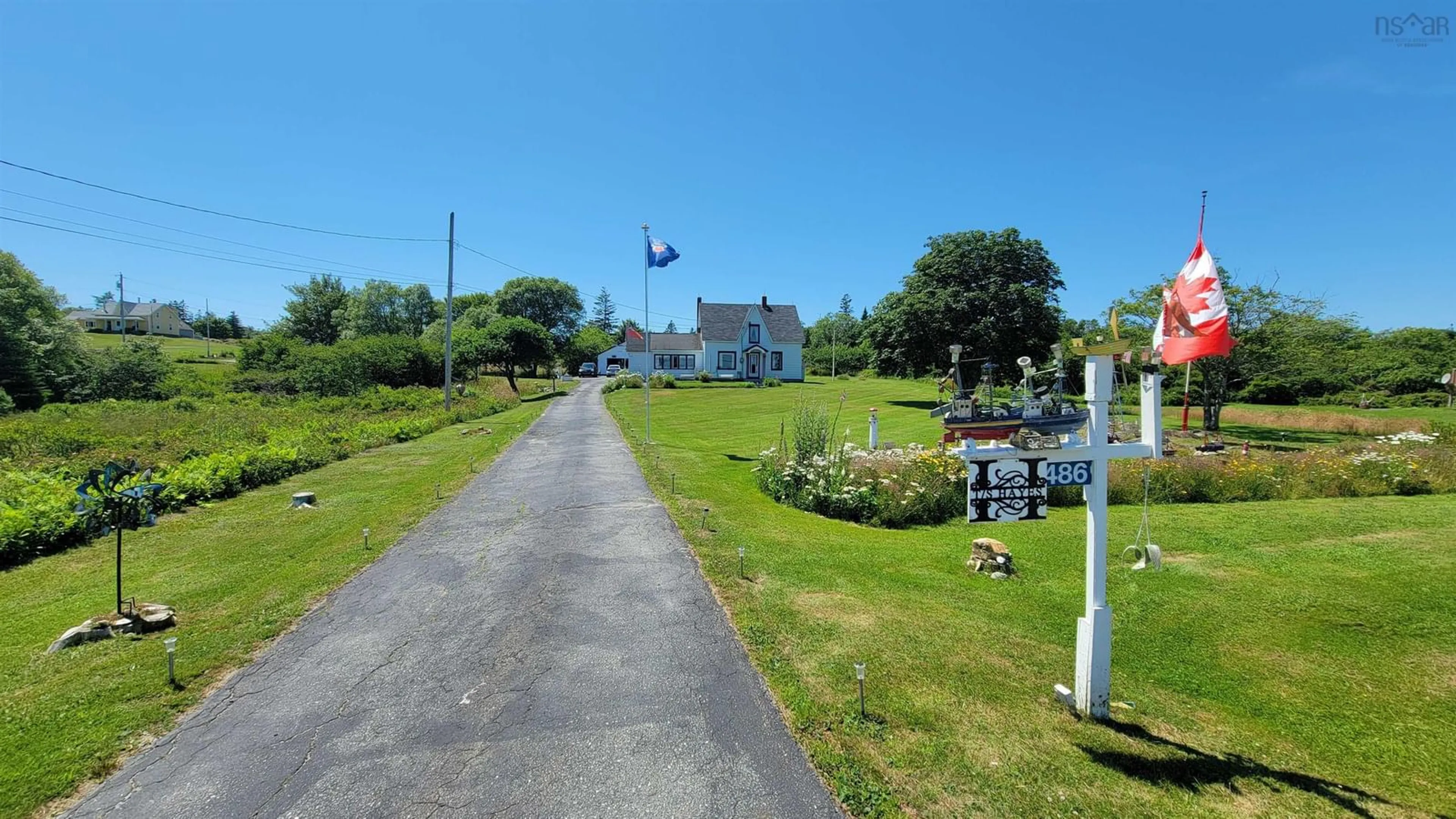 A pic from outside/outdoor area/front of a property/back of a property/a pic from drone, street for 486 335 Hwy, West Pubnico Nova Scotia B0W 3S0