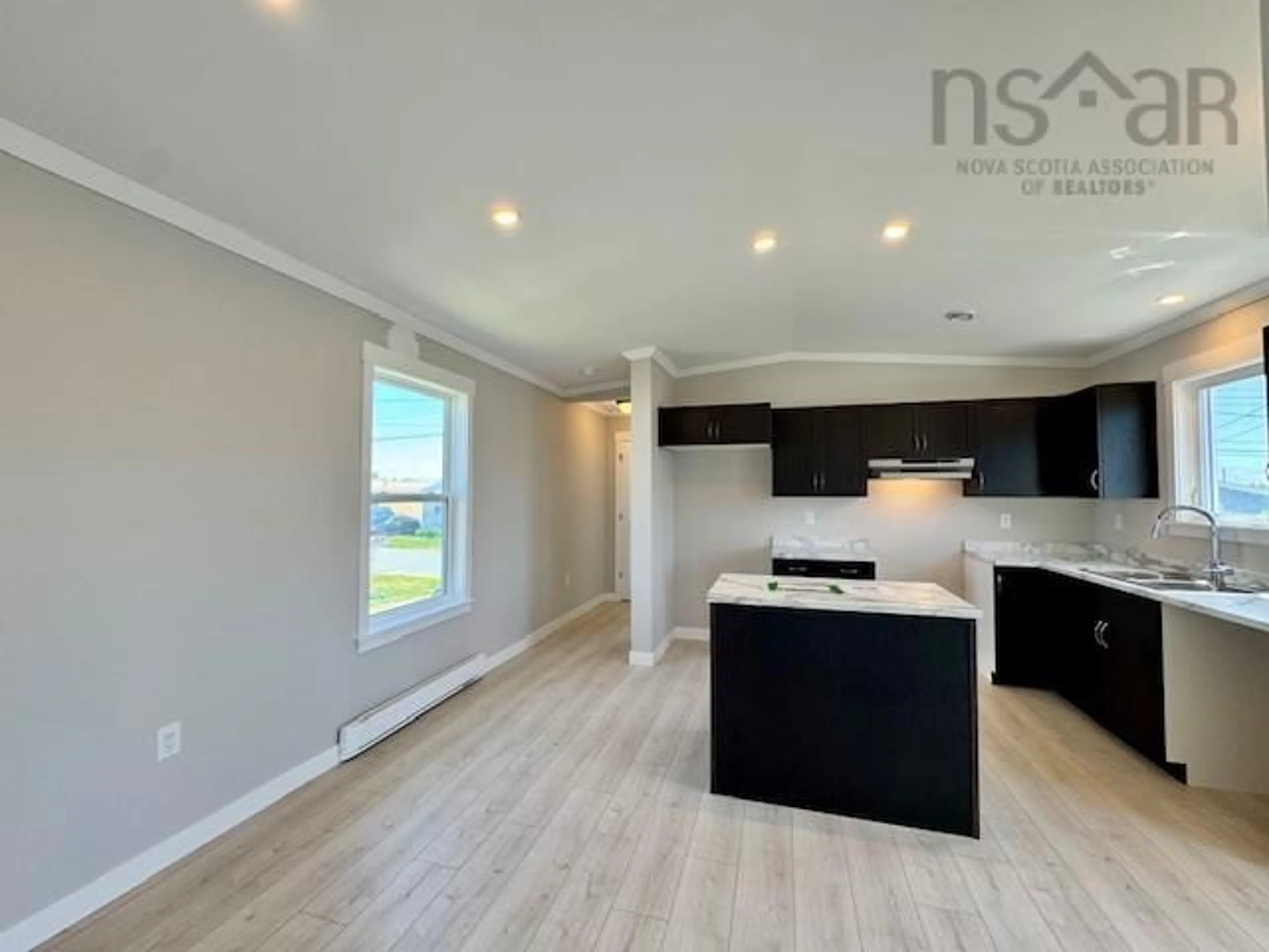 Open concept kitchen, wood/laminate floor for 17 Christopher Ave, South Uniacke Nova Scotia B0N 1Z0
