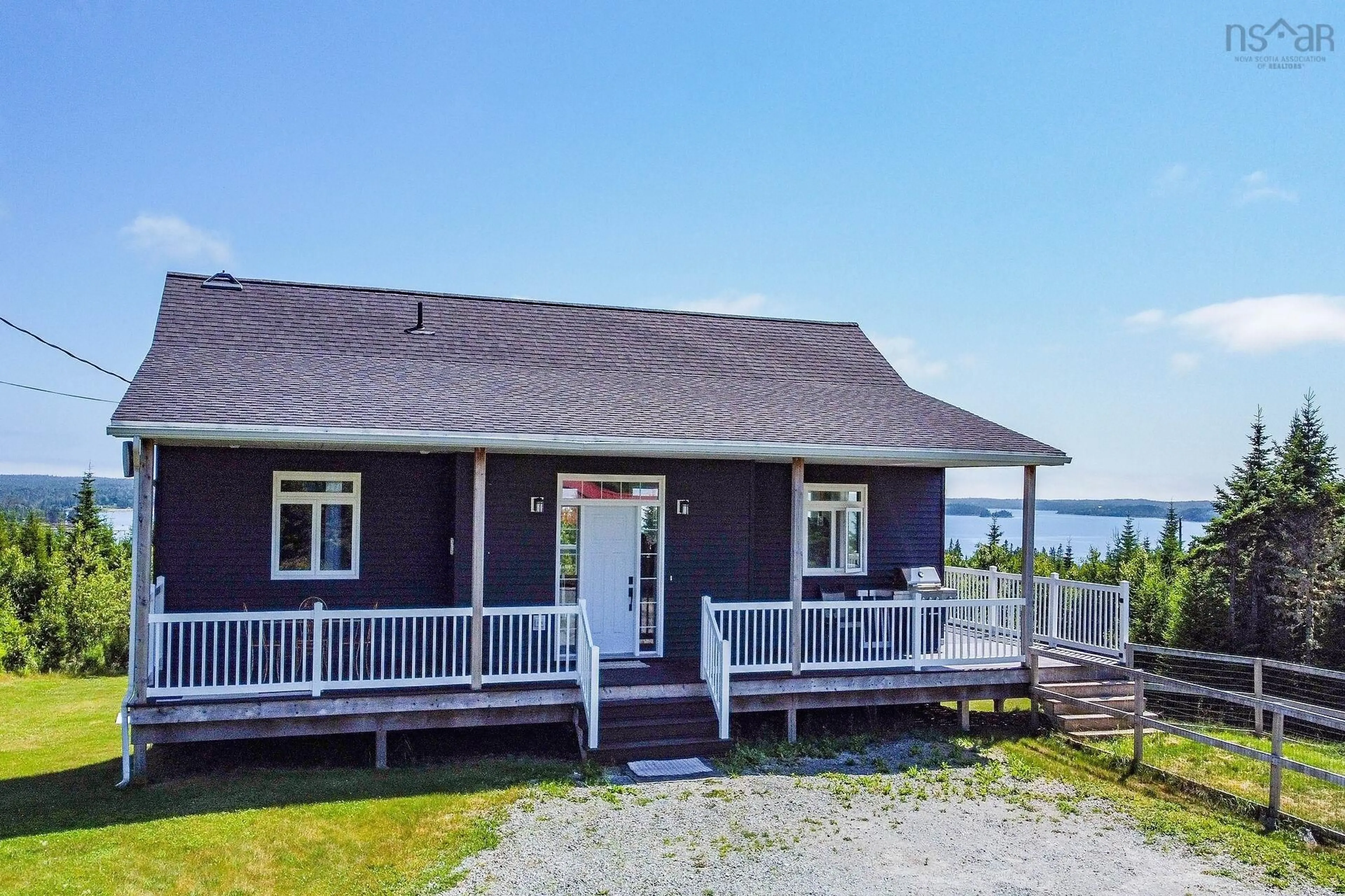 A pic from outside/outdoor area/front of a property/back of a property/a pic from drone, water/lake/river/ocean view for 54 Old Trunk Rd, Oyster Pond Nova Scotia B0J 2L0