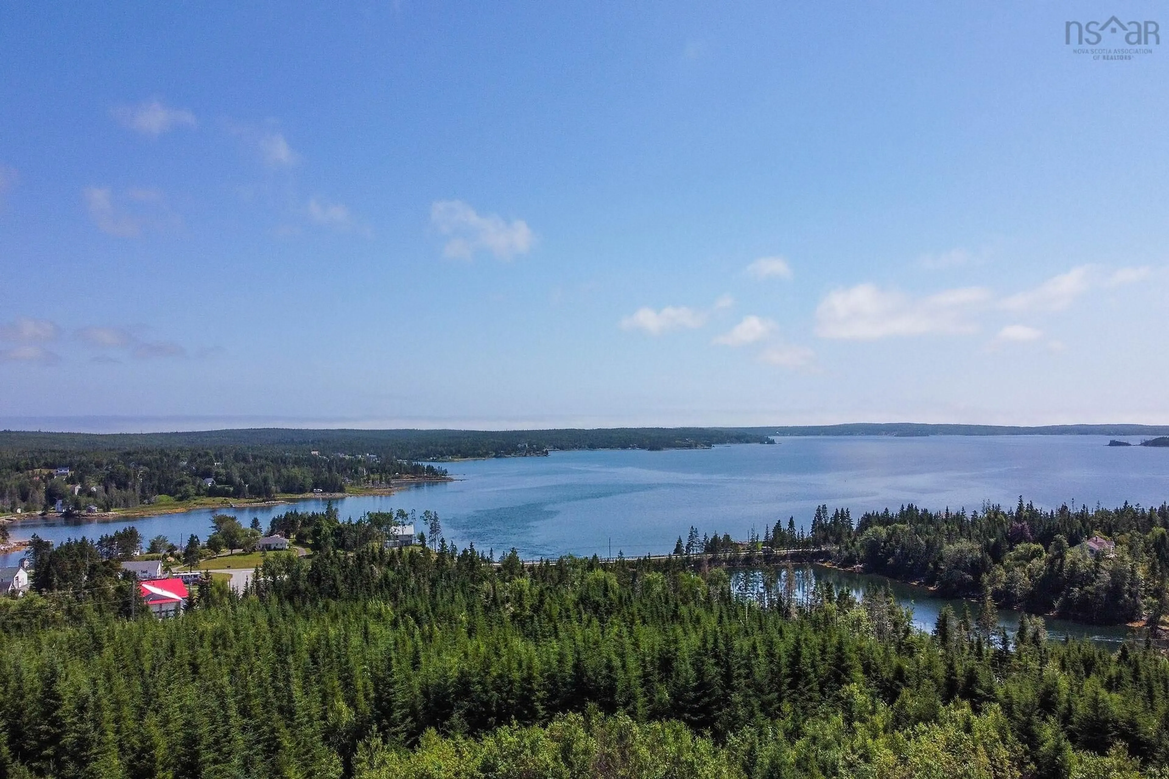 A pic from outside/outdoor area/front of a property/back of a property/a pic from drone, water/lake/river/ocean view for 54 Old Trunk Rd, Oyster Pond Nova Scotia B0J 2L0