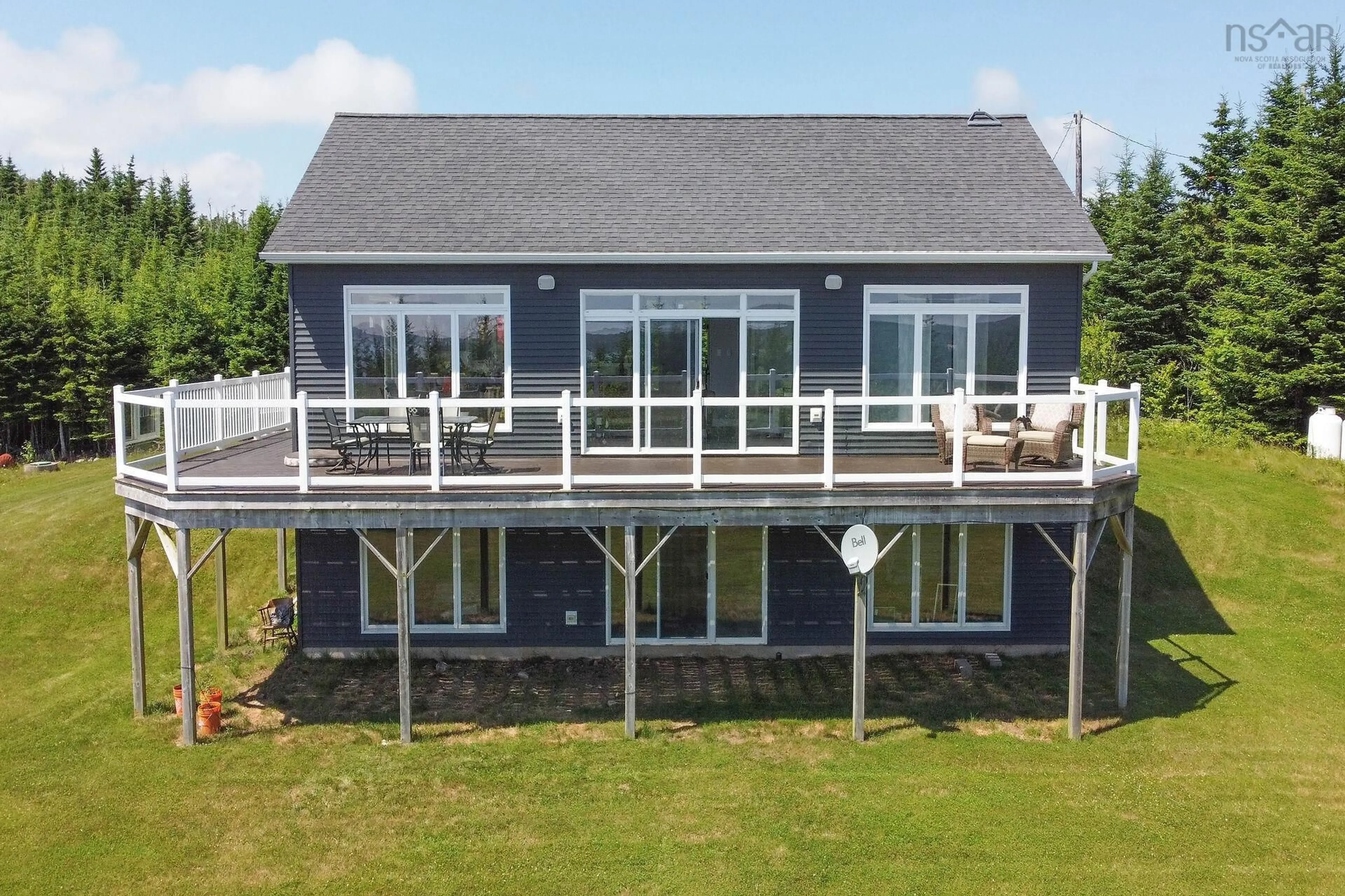 A pic from outside/outdoor area/front of a property/back of a property/a pic from drone, water/lake/river/ocean view for 54 Old Trunk Rd, Oyster Pond Nova Scotia B0J 2L0
