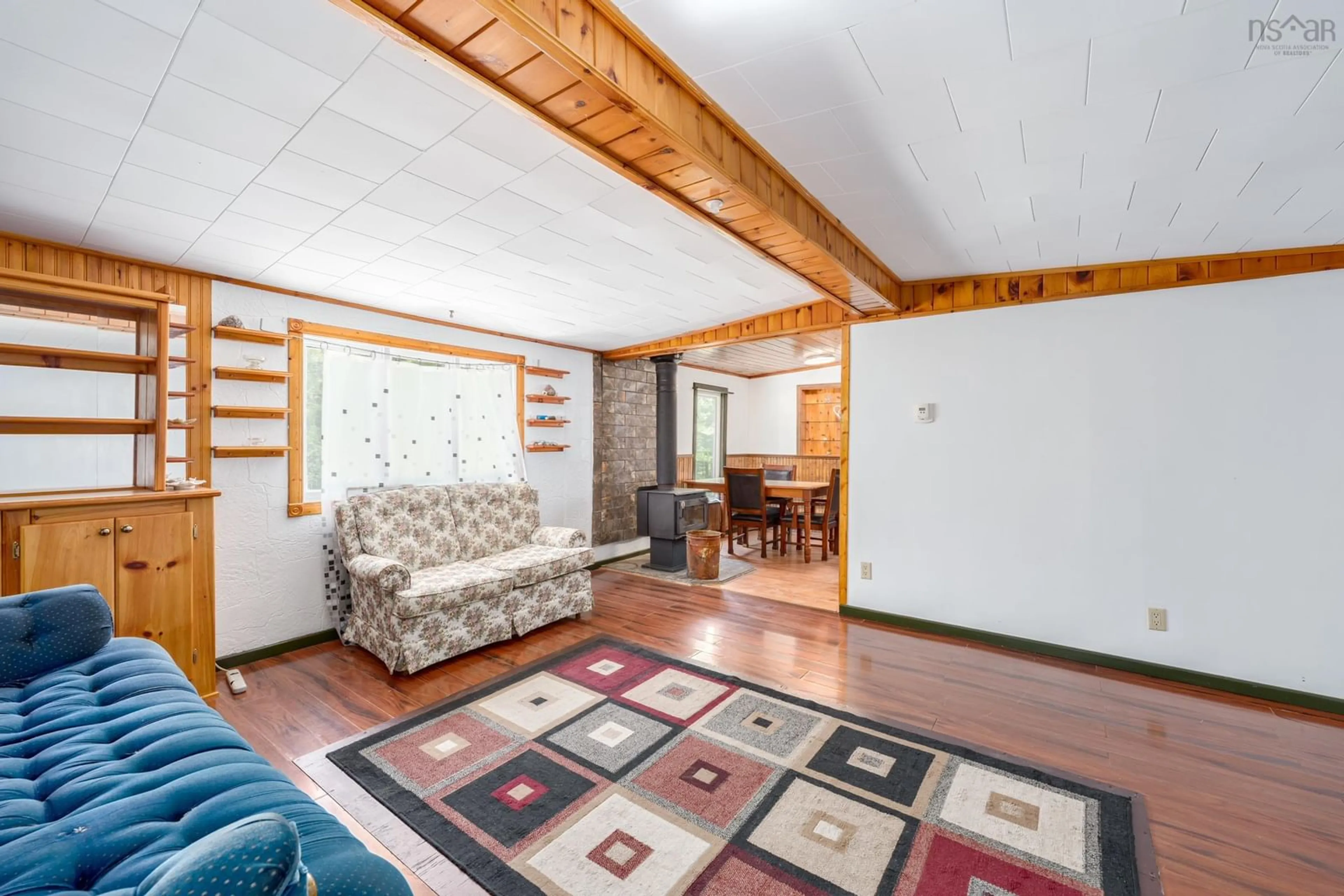 Living room with furniture, wood/laminate floor for 20 Charlie Mullen Corner Rd, Norwood Nova Scotia B5A 5L7
