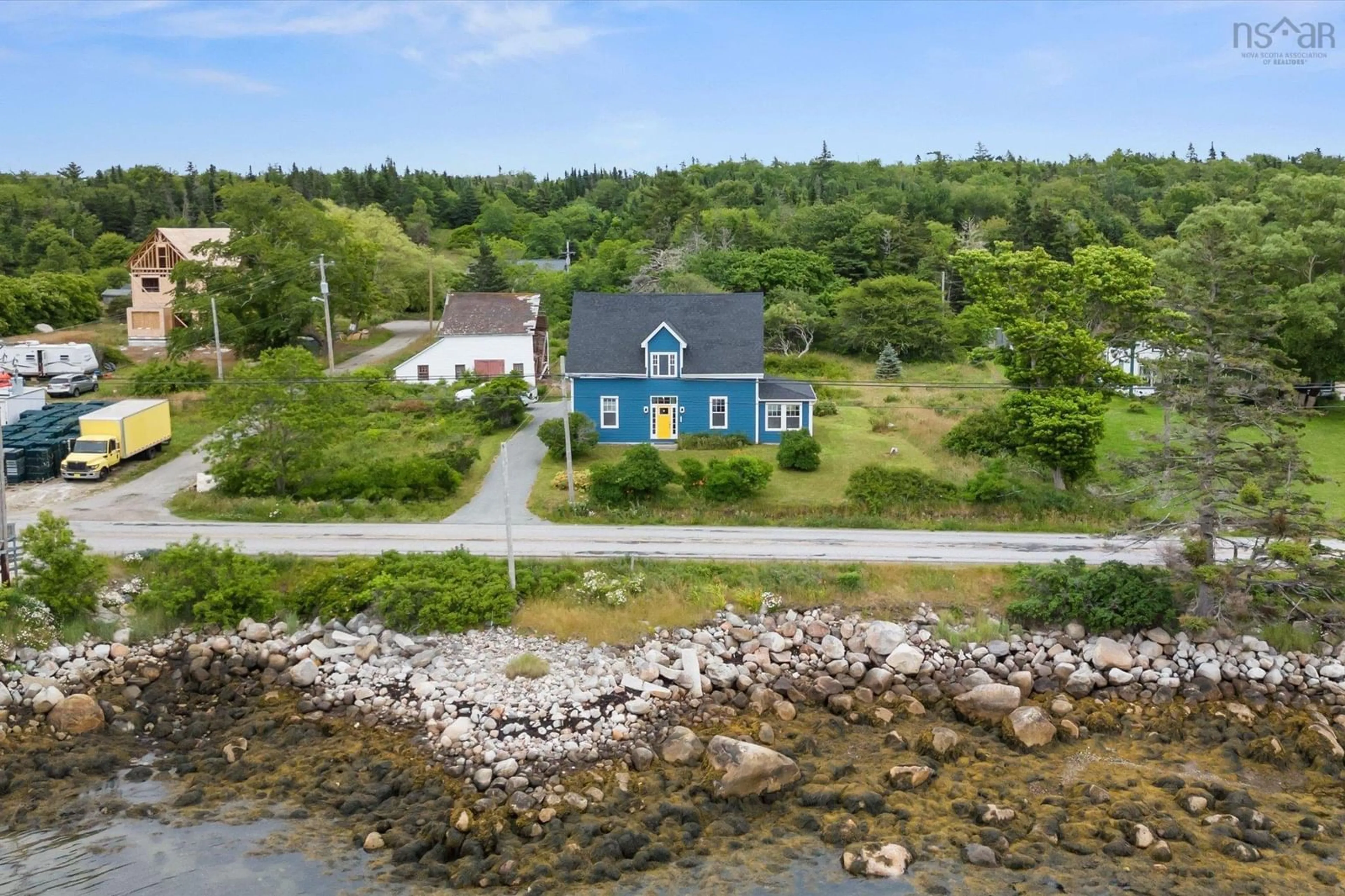A pic from outside/outdoor area/front of a property/back of a property/a pic from drone, water/lake/river/ocean view for 1487 Sandy Point Rd, Sandy Point Nova Scotia B0T 1W0