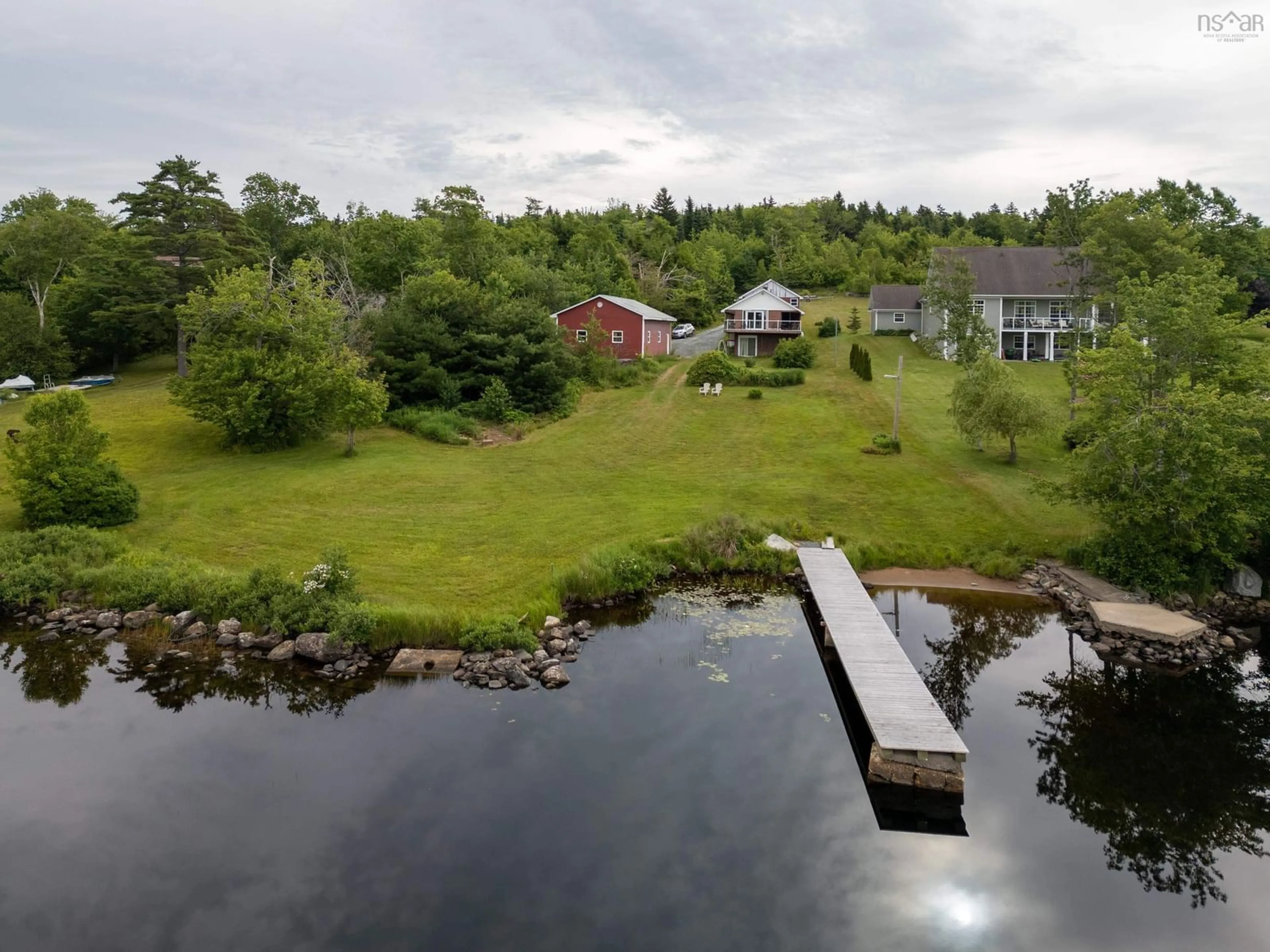 A pic from outside/outdoor area/front of a property/back of a property/a pic from drone, water/lake/river/ocean view for 130 Whisper Ridge, Porters Lake Nova Scotia B3E 1J6
