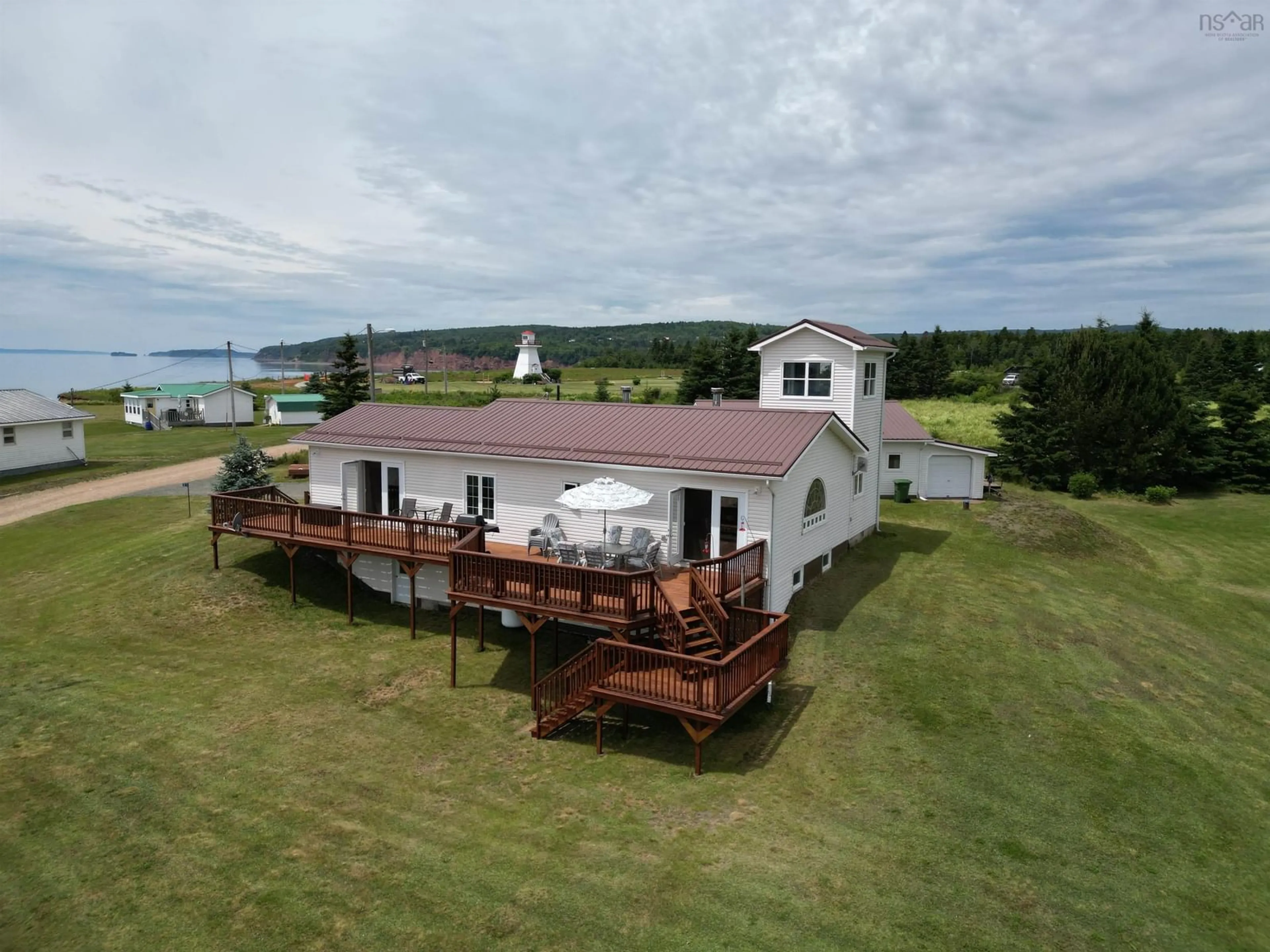 A pic from outside/outdoor area/front of a property/back of a property/a pic from drone, water/lake/river/ocean view for 21 North River Lane, Lower Five Islands Nova Scotia B0M 1N0