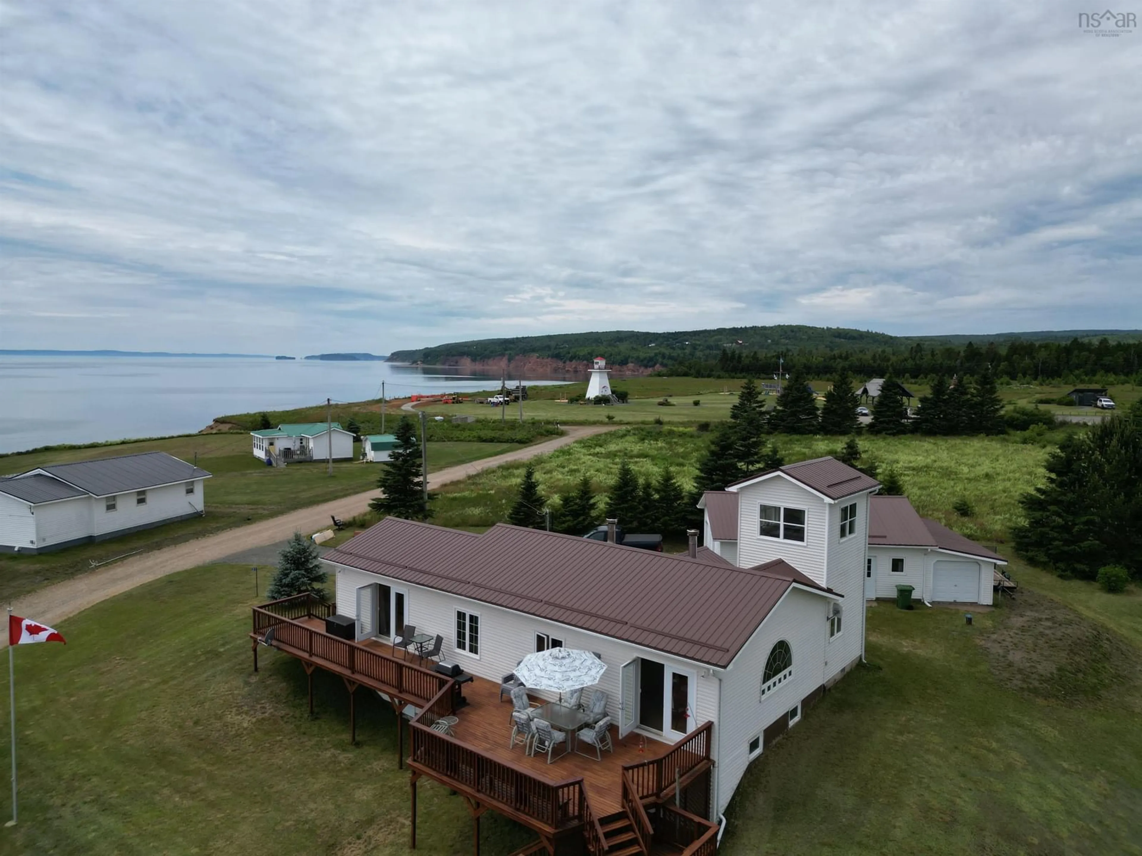 A pic from outside/outdoor area/front of a property/back of a property/a pic from drone, water/lake/river/ocean view for 21 North River Lane, Lower Five Islands Nova Scotia B0M 1N0