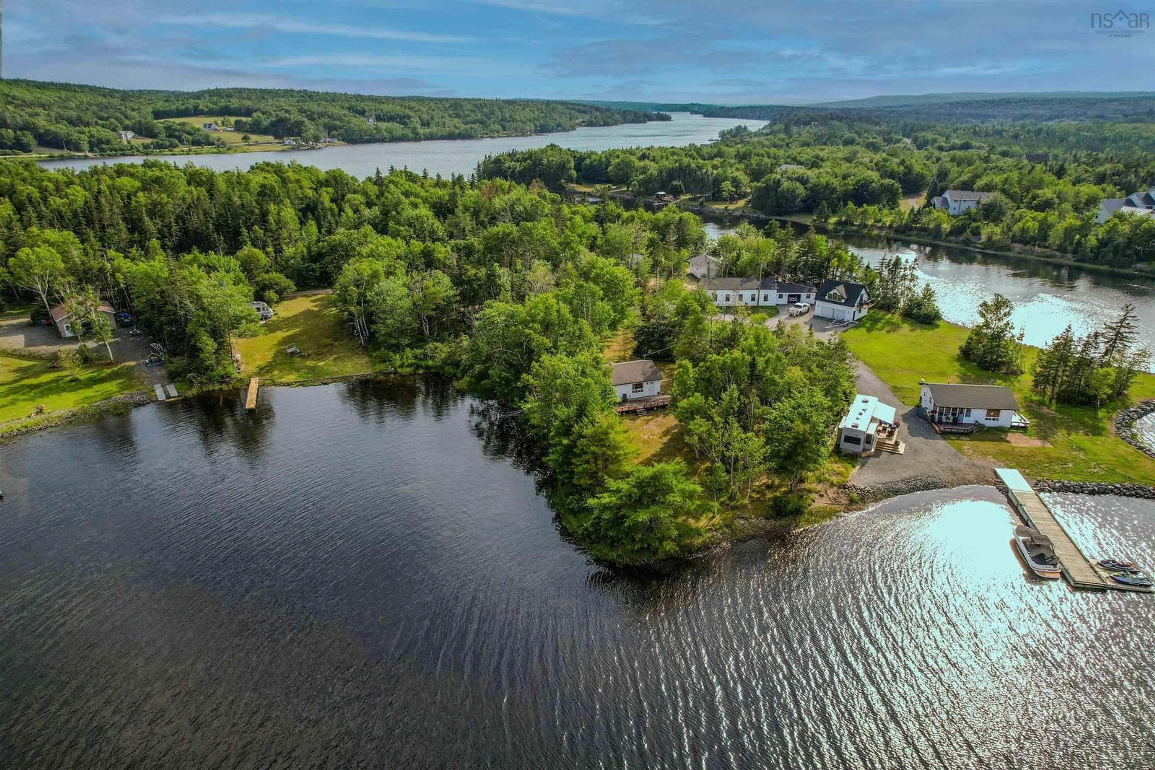 A pic from outside/outdoor area/front of a property/back of a property/a pic from drone, water/lake/river/ocean view for 200 Campbell St, Marion Bridge Nova Scotia B1K 2H4