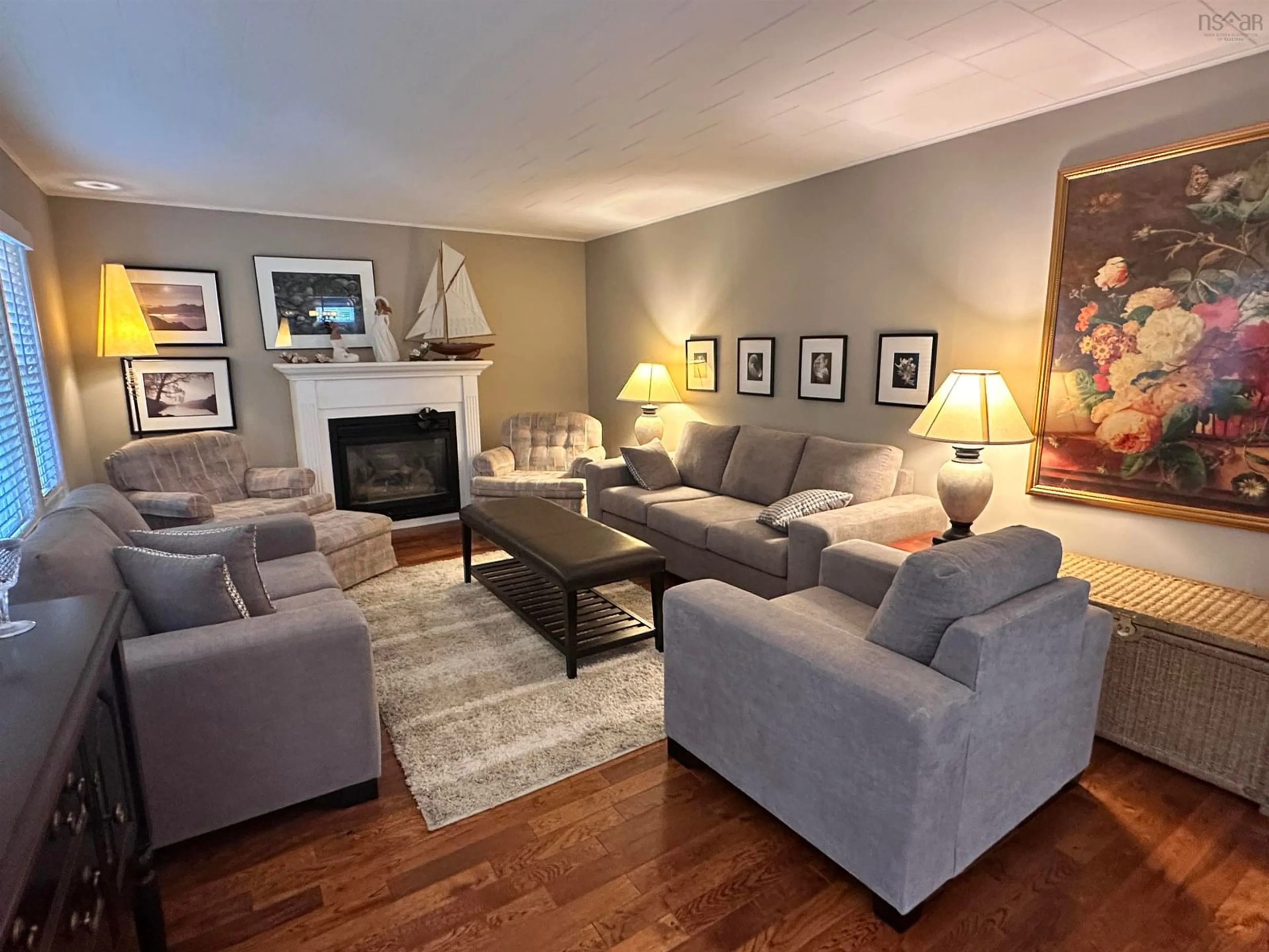 Living room with furniture, wood/laminate floor for 235 Waterloo St, Liverpool Nova Scotia B0T 1K0