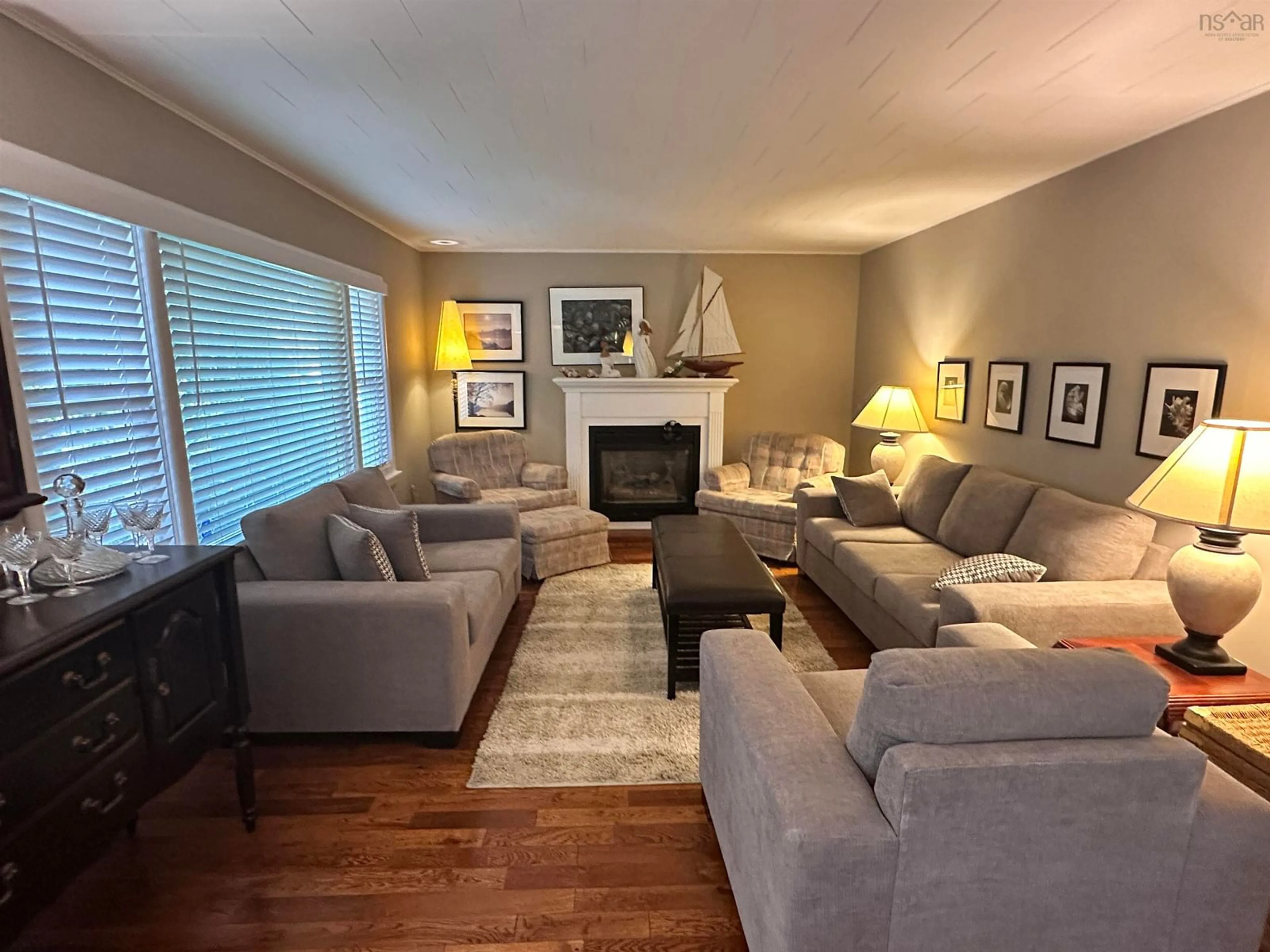 Living room with furniture, wood/laminate floor for 235 Waterloo St, Liverpool Nova Scotia B0T 1K0